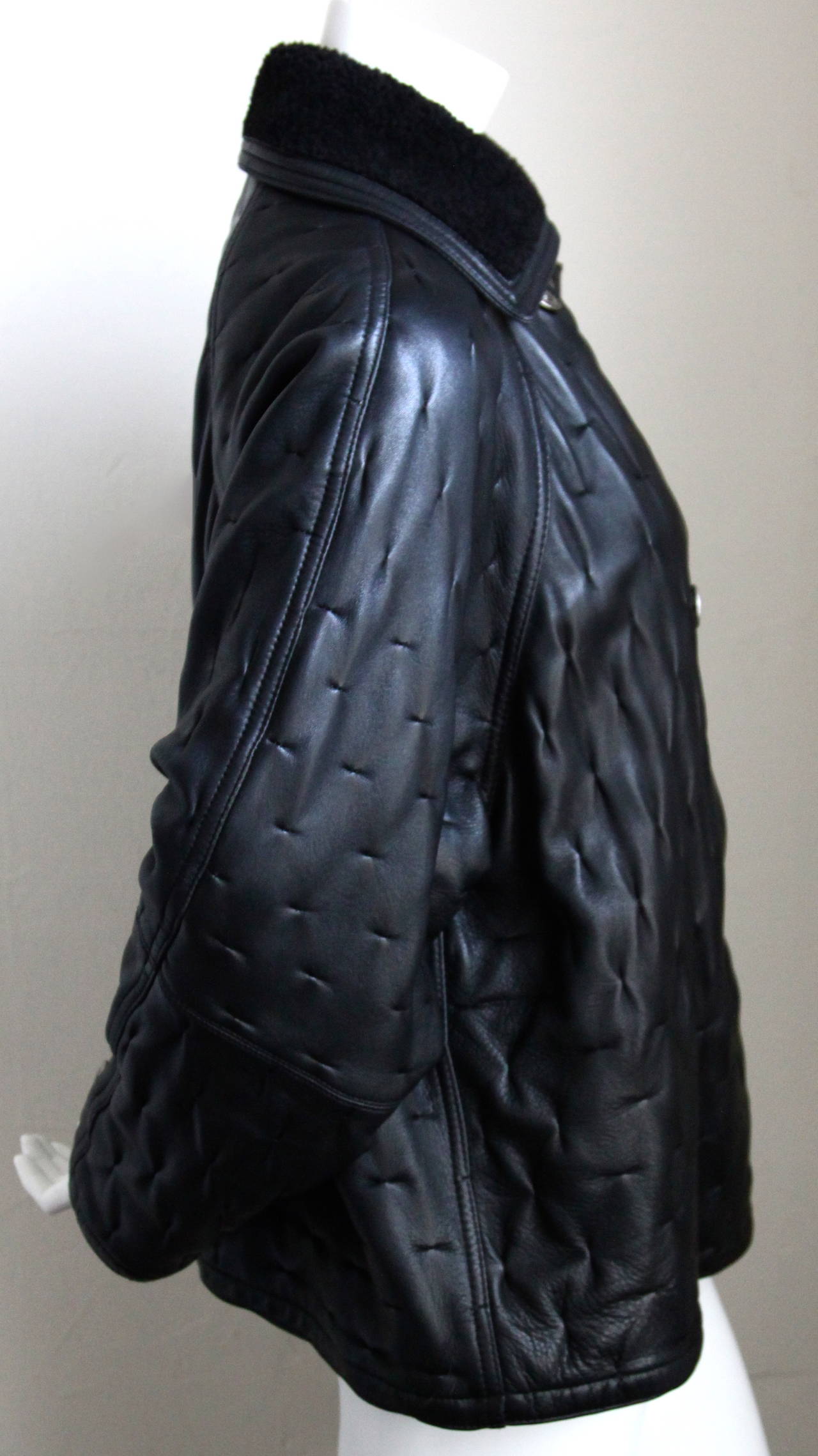 1990's GIANNI VERSACE black leather coat with shearling trip & Medusa buttons