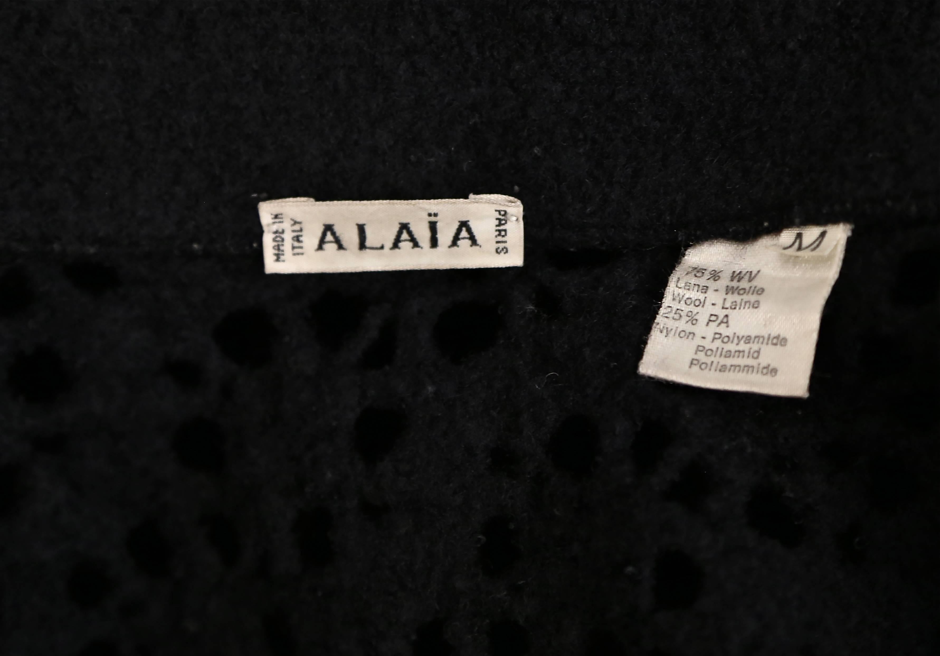 1990's AZZEDINE ALAIA black open knit jacket with flared hem and fringed trim In Good Condition In San Fransisco, CA