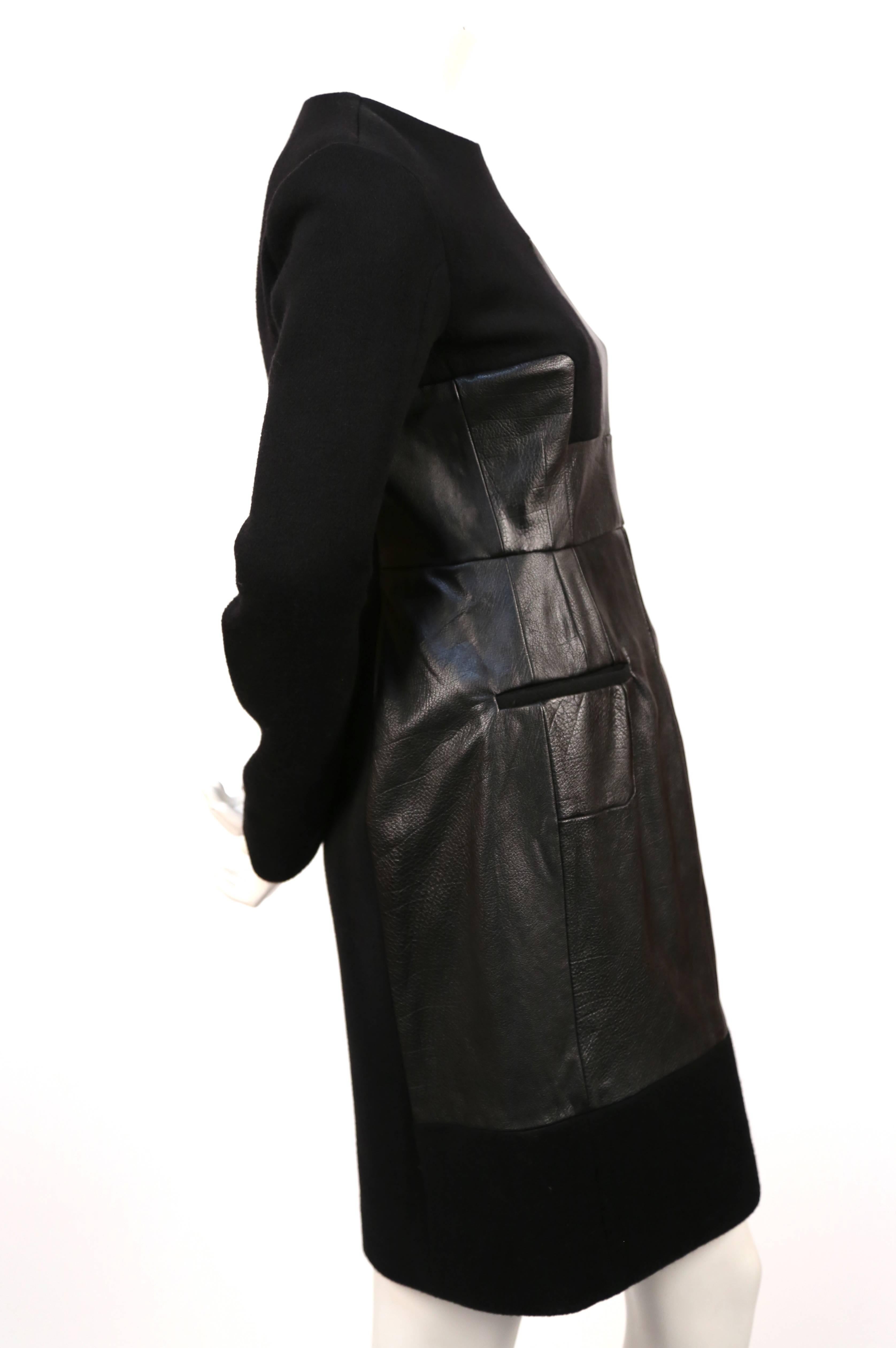 Black wool and patchwork leather dress designed by Phoebe Philo for Celine as seen on the fall 2011 runway. Very rare piece. Dress is a French size 38. Approximate measurements:  shoulder 15.5", bust 34", waist 32", hips 40" ,