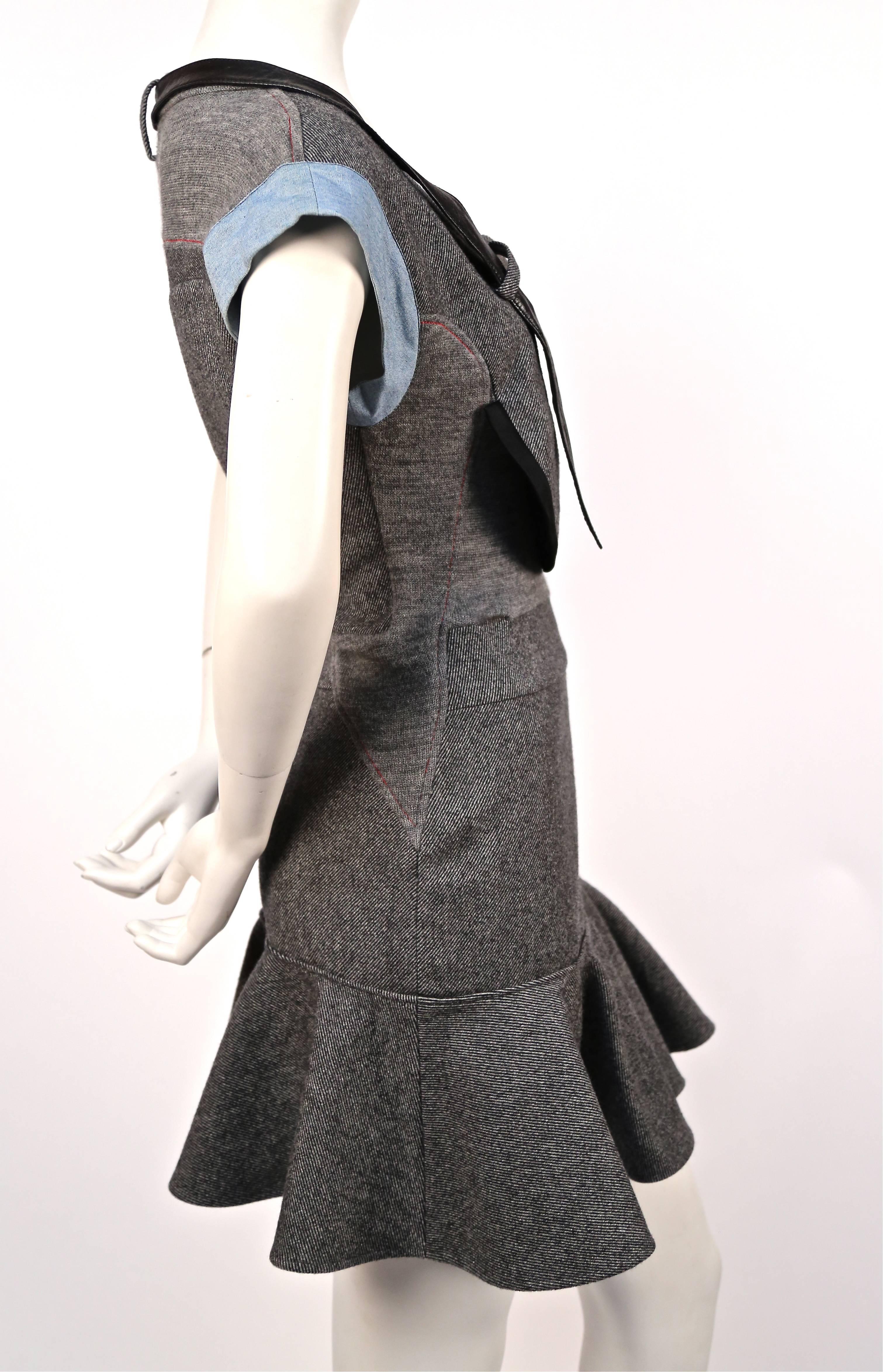 Very rare grey wool patchwork dress with denim and leather trim designed by Nicolas Ghesquière for Balenciaga exactly as seen on the fall 2002 runway. Labeled a French 40 however this would best fit a French 38. Side zip entry. Made in France.