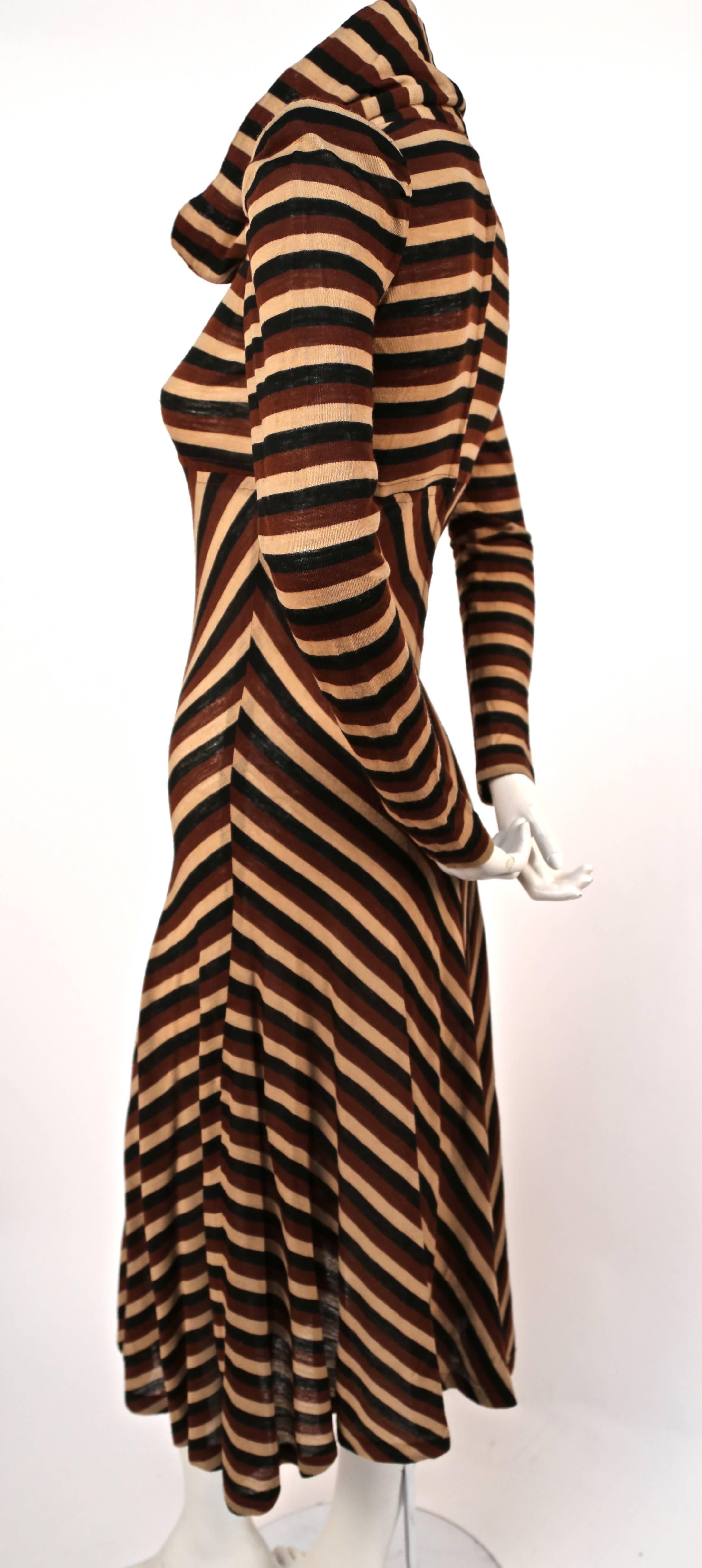 Metallic brown, cream and black striped wool jersey dress with cowl neckline and chevron design from Biba dating to the 1970's. Best fits a US 2 or slim 4. Zips up center back. Made in the U.K. Excellent condition. 