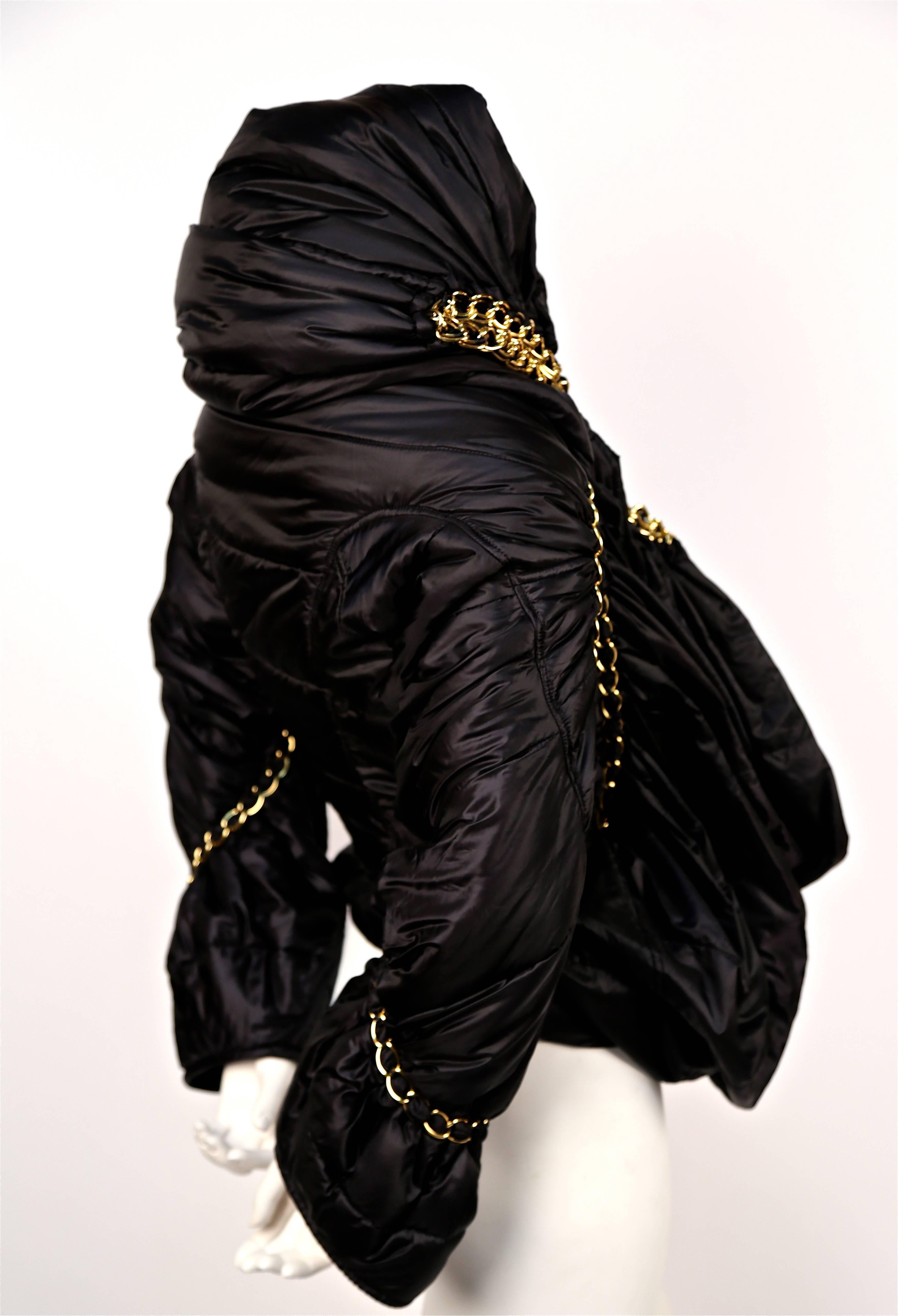 Black JUNYA WATANABE black draped puffer coat with gold chain trim - runway 2009
