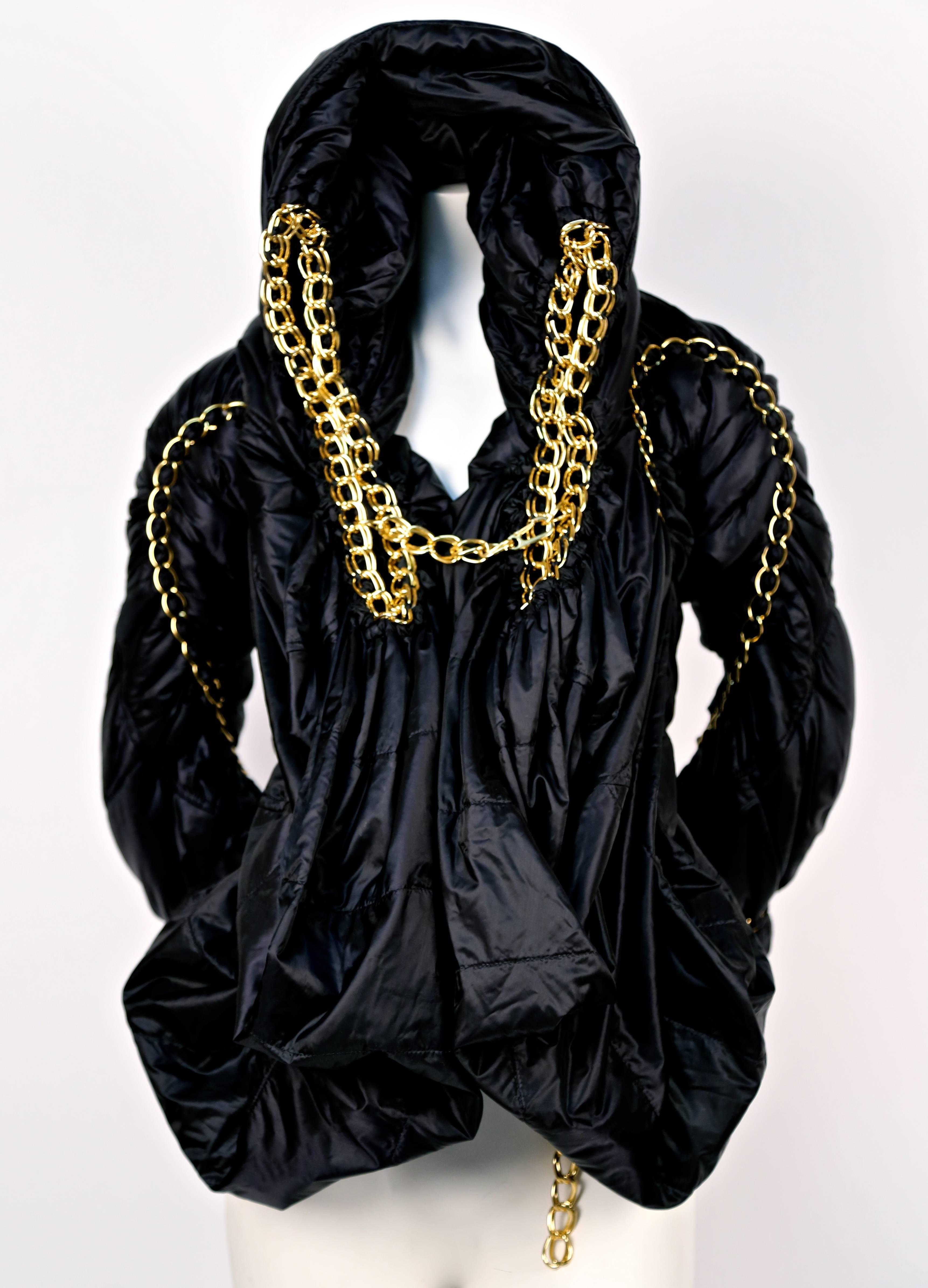Very rare jet black draped puffer coat with intricately woven gold toned chain and oversized hood from Junya Watanabe exactly as seen on the runway for fall of 2009. Japanese size 'S'. Measurement are difficult to take but this best fits a size XS