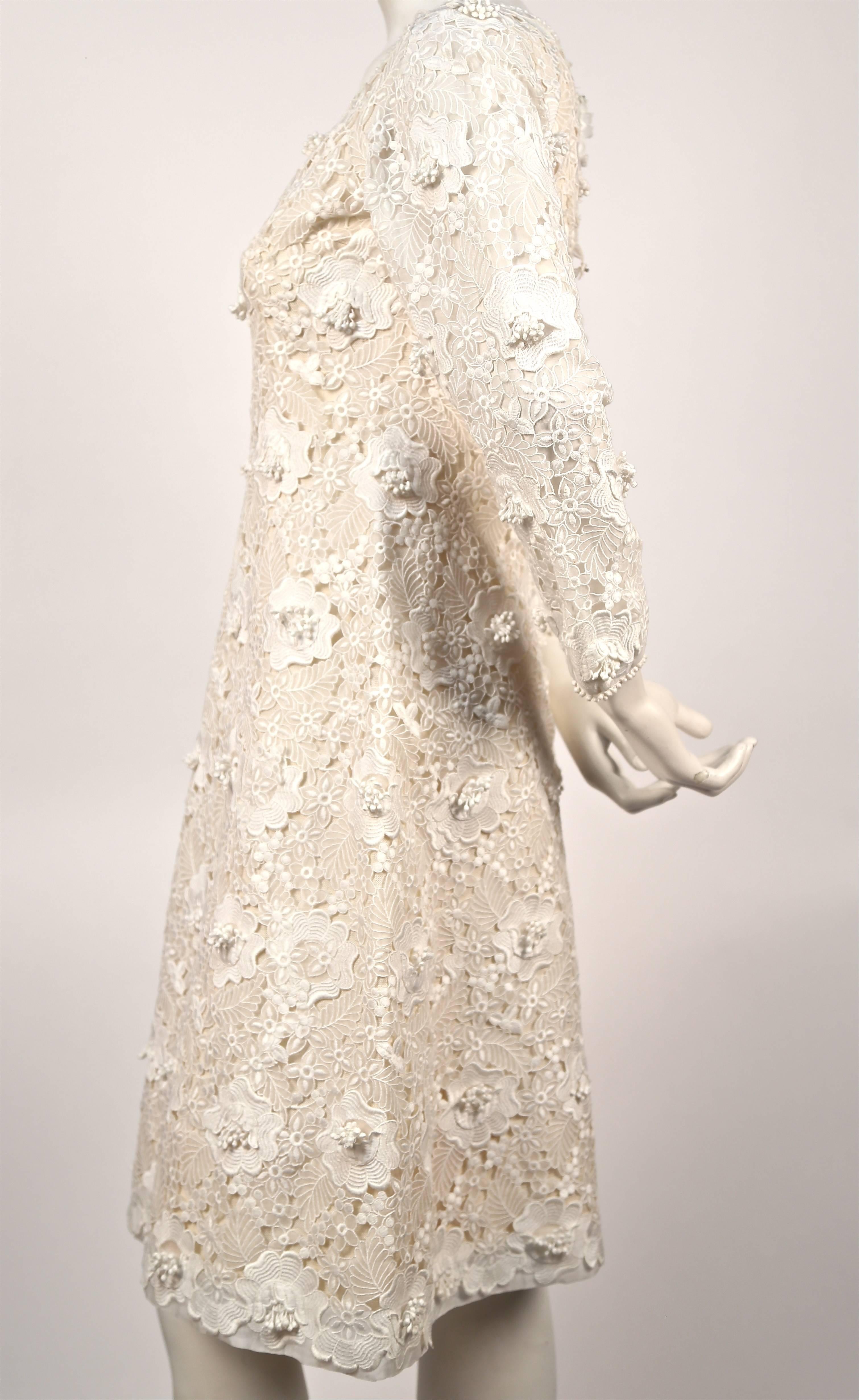 Stunning off white Venice lace dress from Yves Saint Laurent dating to 1964. All the details and hand finishing you would find in a haute couture garment. Great as a wedding dress for a modern bride. Dress is very small and would not zip up fully on