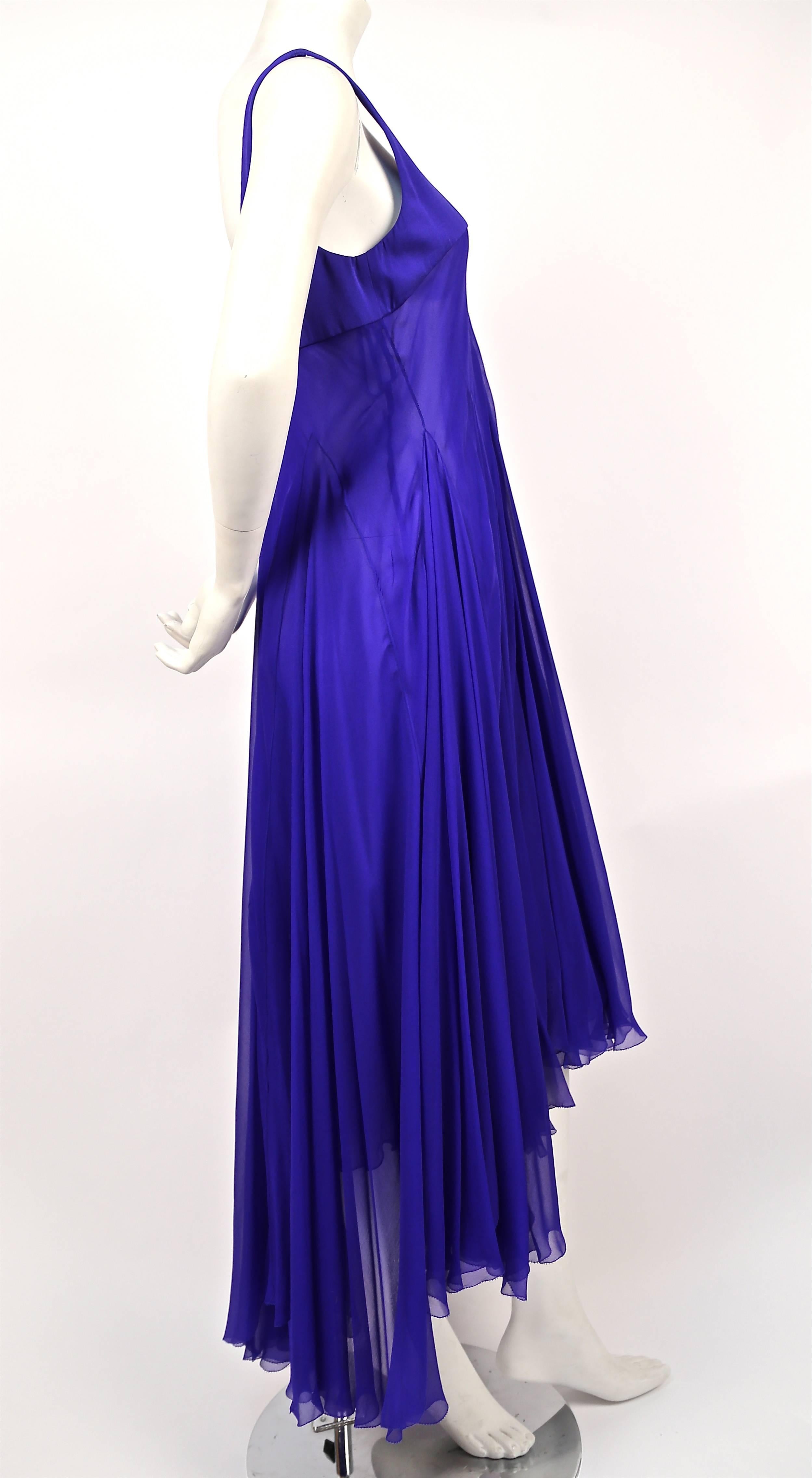Vivid cobalt blue asymmetrically seamed silk chiffon gown from Alexander McQueen dating to c. 2006. Italian size 44, however this dress runs small due to the bias cut and would best fit a US 4 or 6. Approximate measurements: bust 34", waist