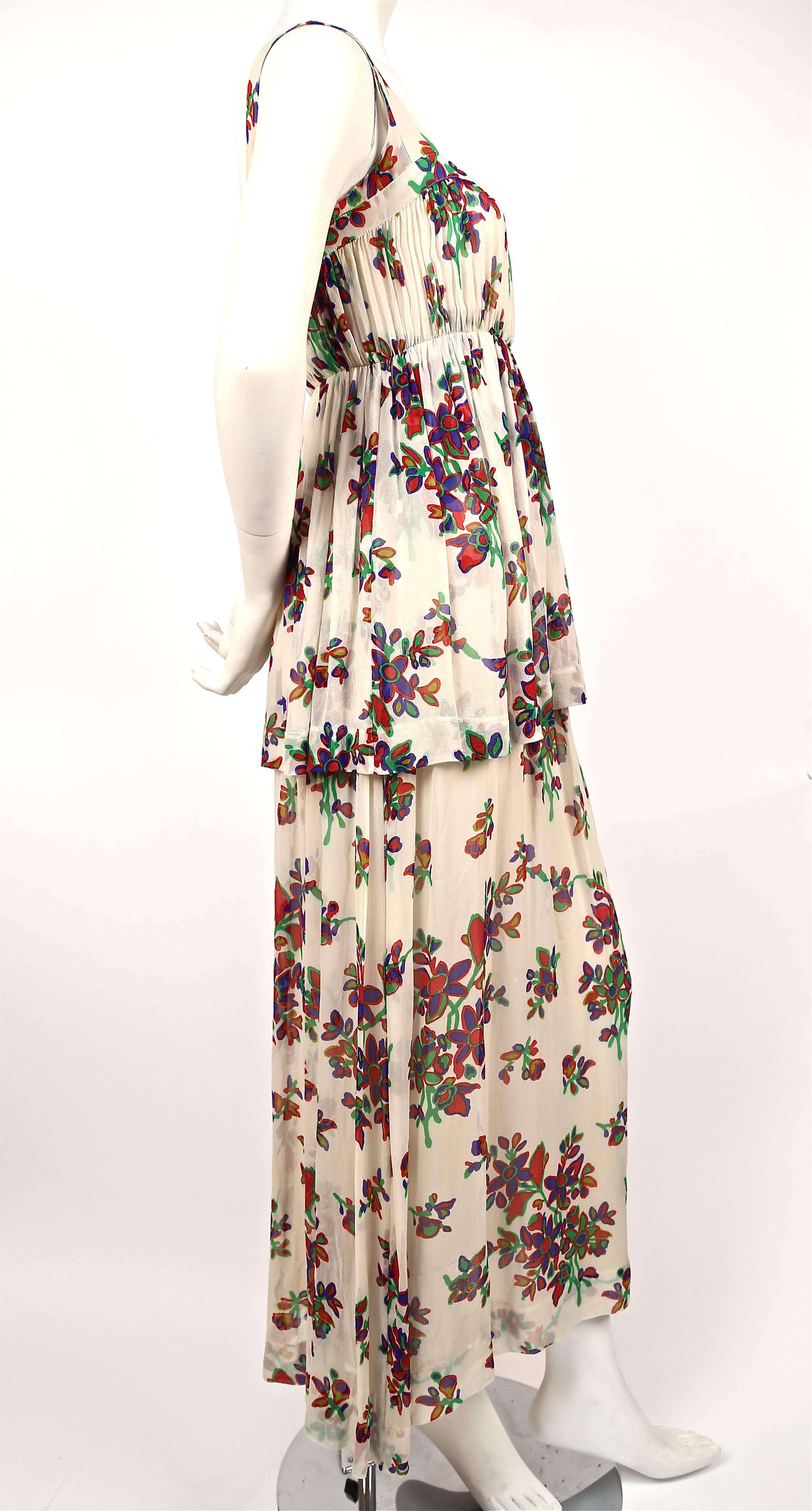 Delicate floral silk chiffon summer dress designed by Yves Saint Laurent dating to the 1970s. Best fits a size 4 or 6. Approximate measurements: bust 32-33", waist 26.5-27" and length 53-54". Fully lined in cream silk. Zips up center