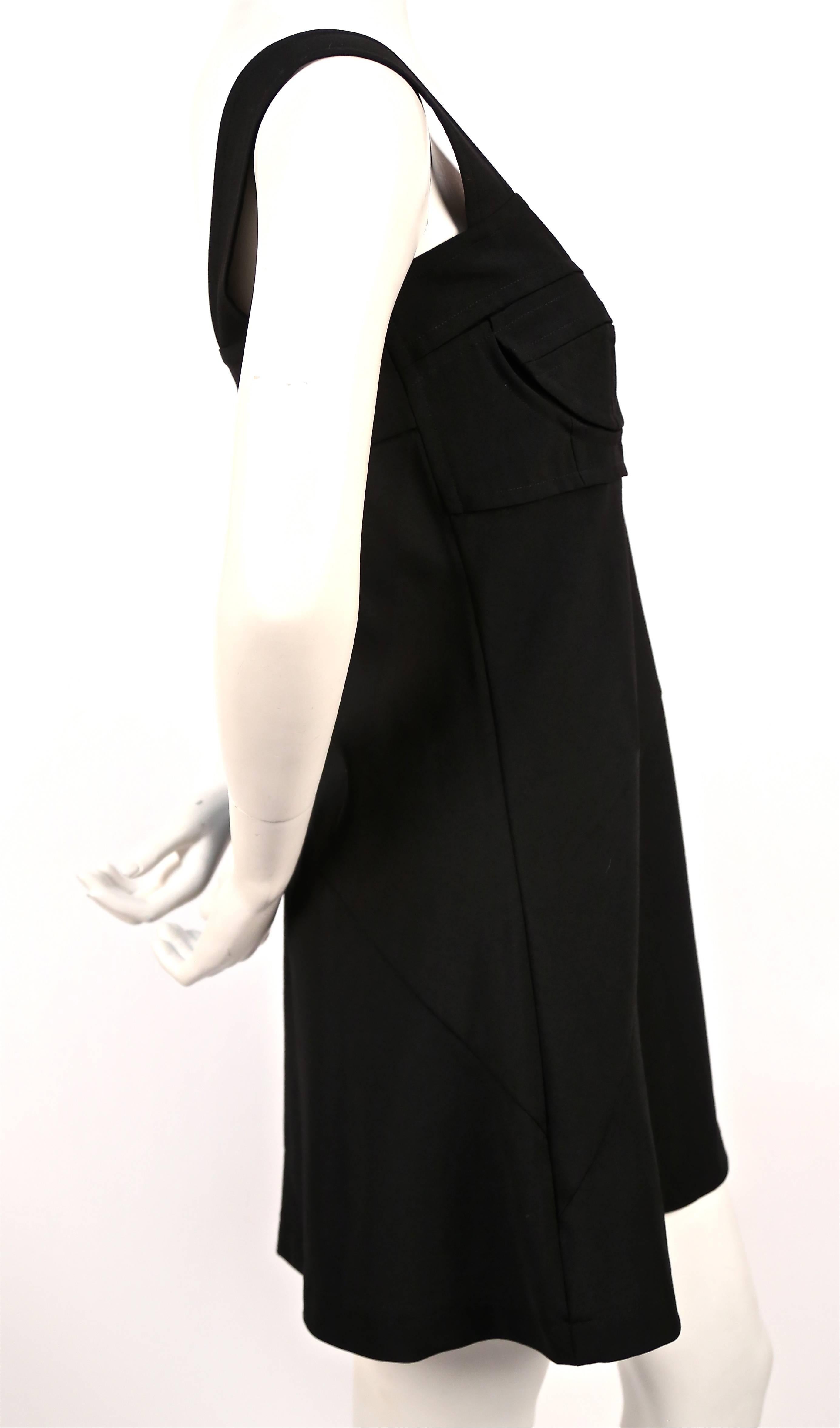 Jet black seamed bustier style mini dress from Comme des Garcons dating to 2001. Measures approximately 34
