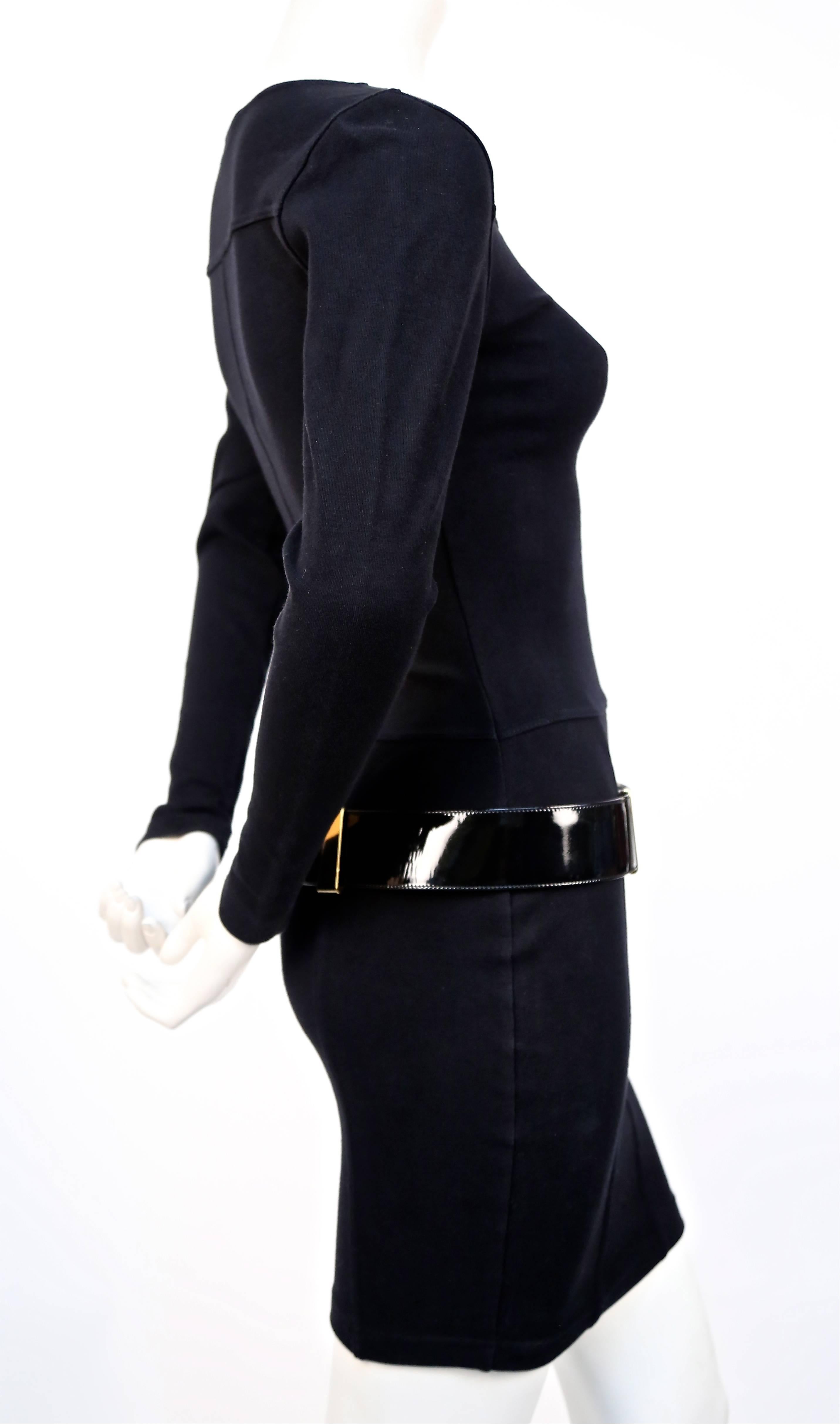 Black knit dress with gold hardware and black patent leather belt from Claude Montana dating to the early 1990's. Dress is labeled a French 40 (Italian 42) and best fits a size S. Approximate measurements un-stretched laying flat: shoulders  15