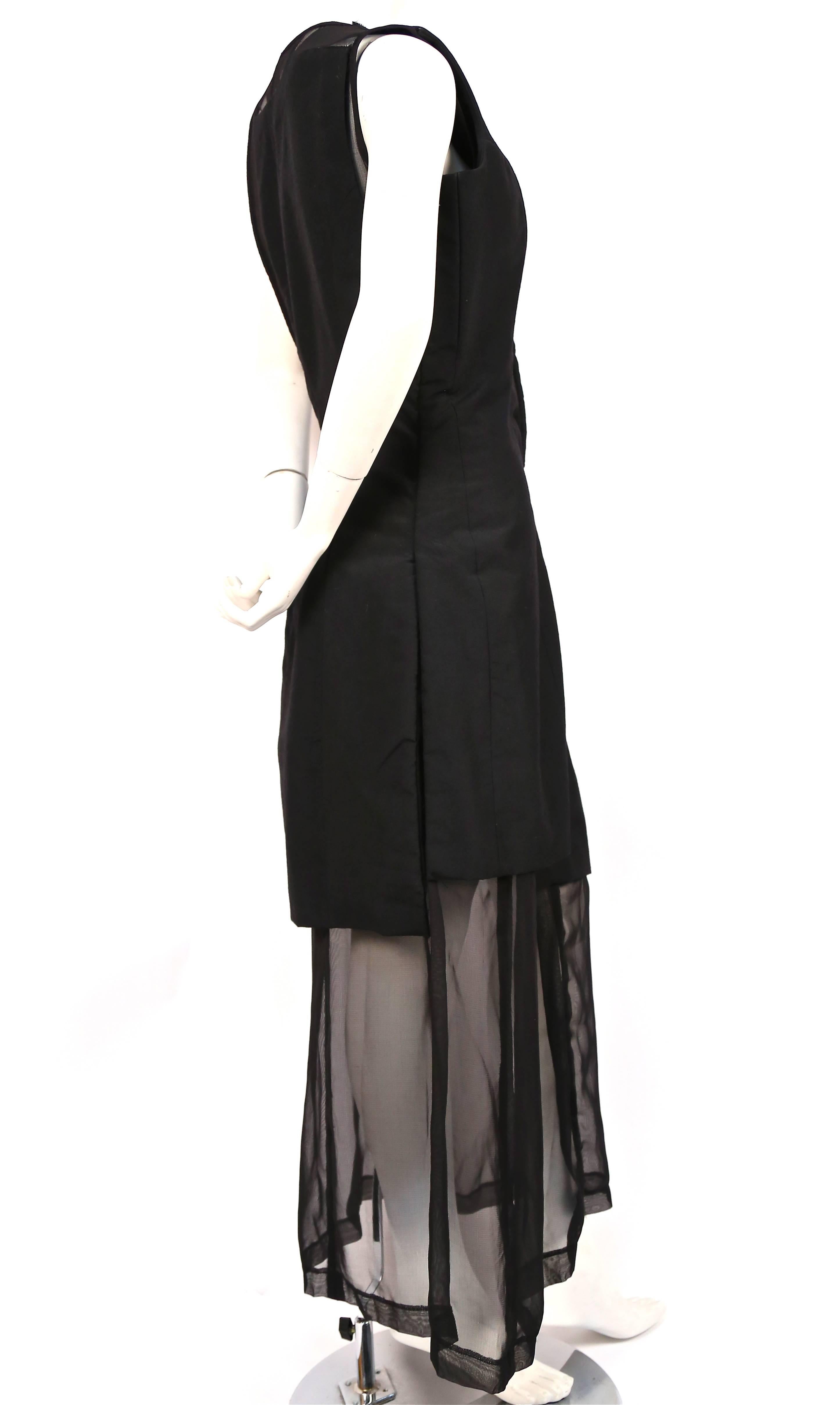 Black padded dress with sheer inserts and skirting from Comme Des Garcons dating to Fall of 1997 exactly as seen on the runway. Labeled a size 'M'. Approximate measurement: bust 40", waist 36", hips 42" and length 55-56".  Side