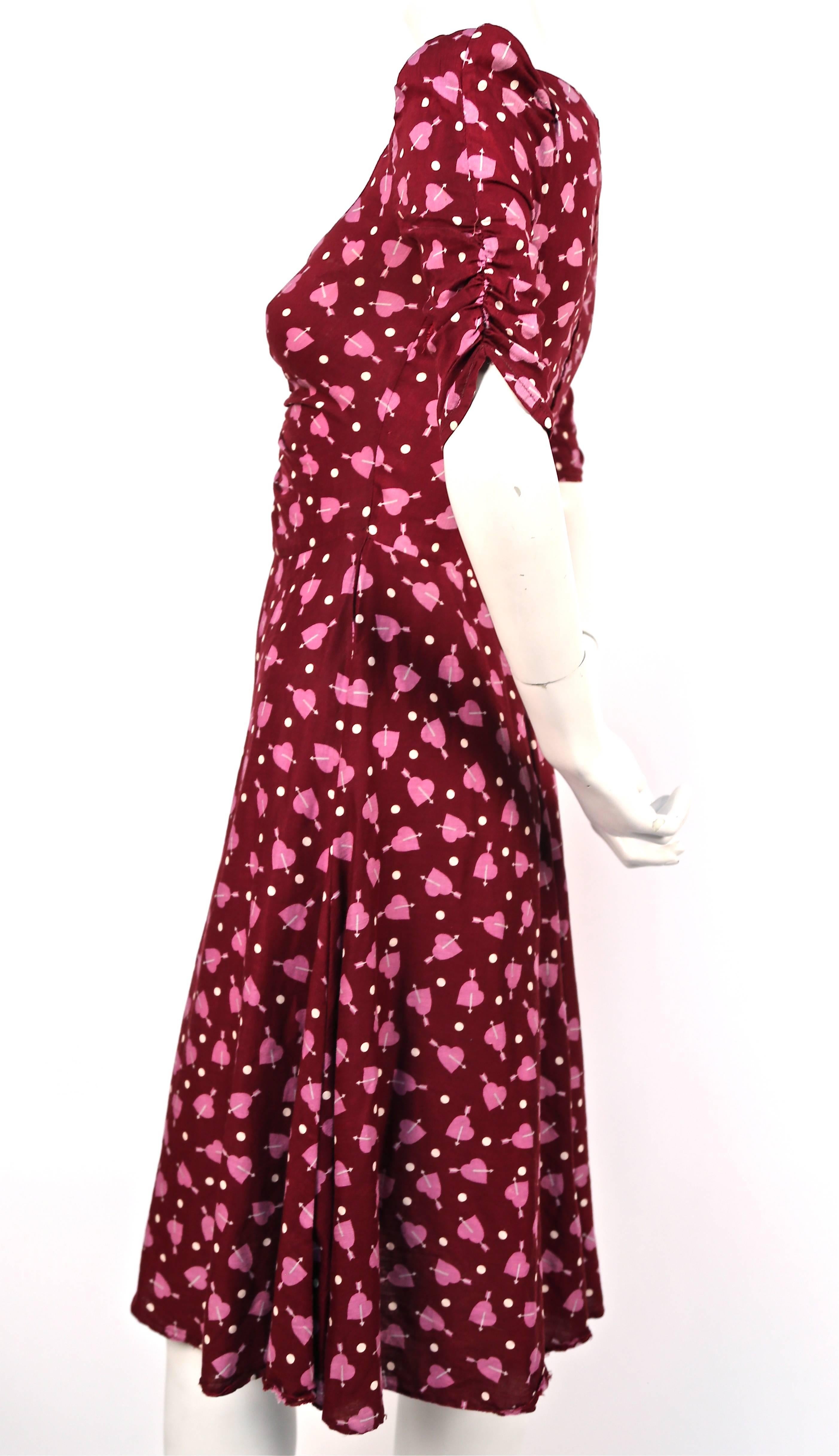 Heart & arrow printed cotton dress from Biba dating to the 1970's. No size indicated however this would best fit a US size 2. Approximate measurements: shoulder 12