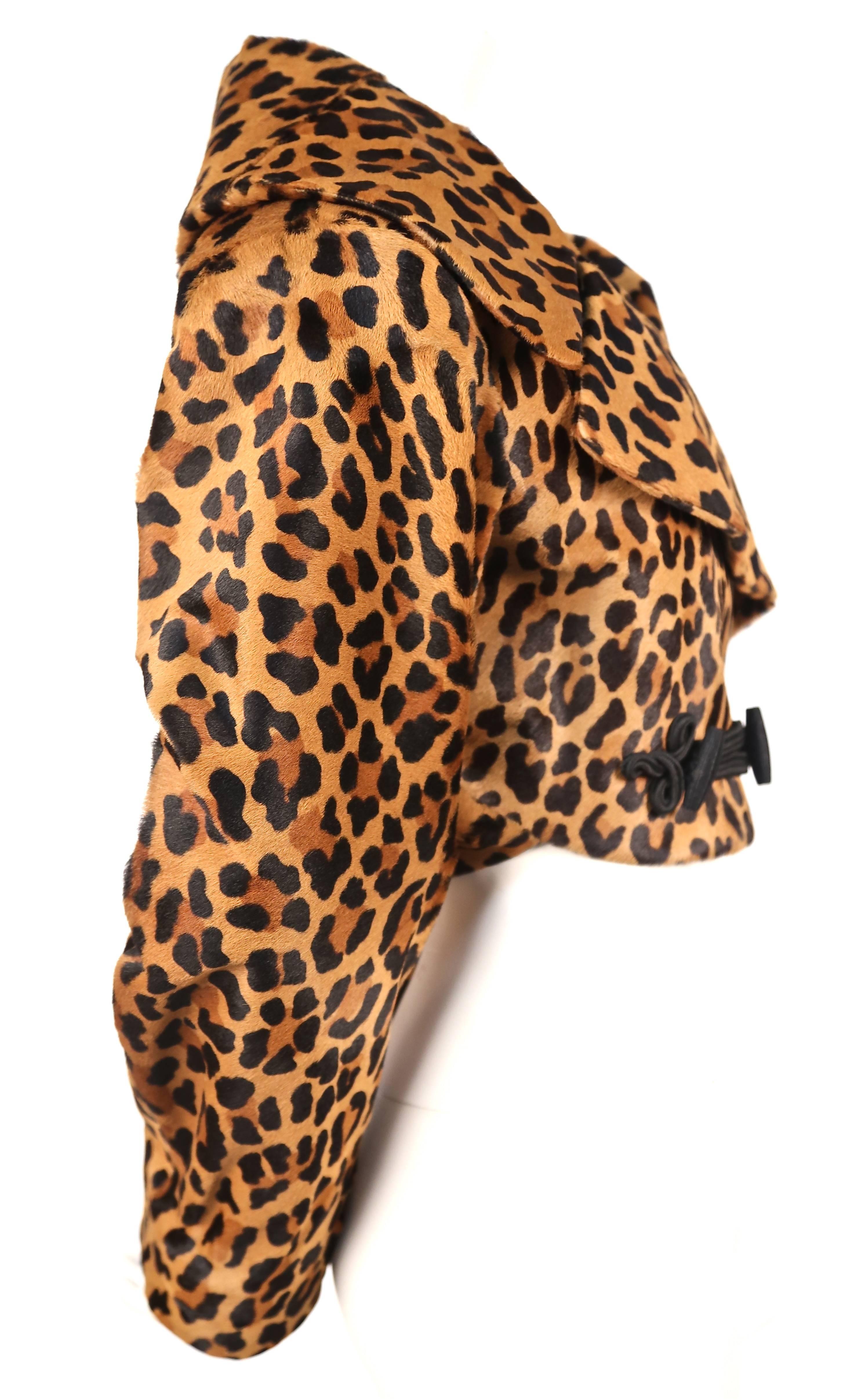 Extremely rare leopard printed calf fur jacket with decorative black frog closure designed by Azzedine Alaia dating to fall of 1991 exactly as seen on the runway. Labeled a French size 38 although there is some flexibility due to the cut. 