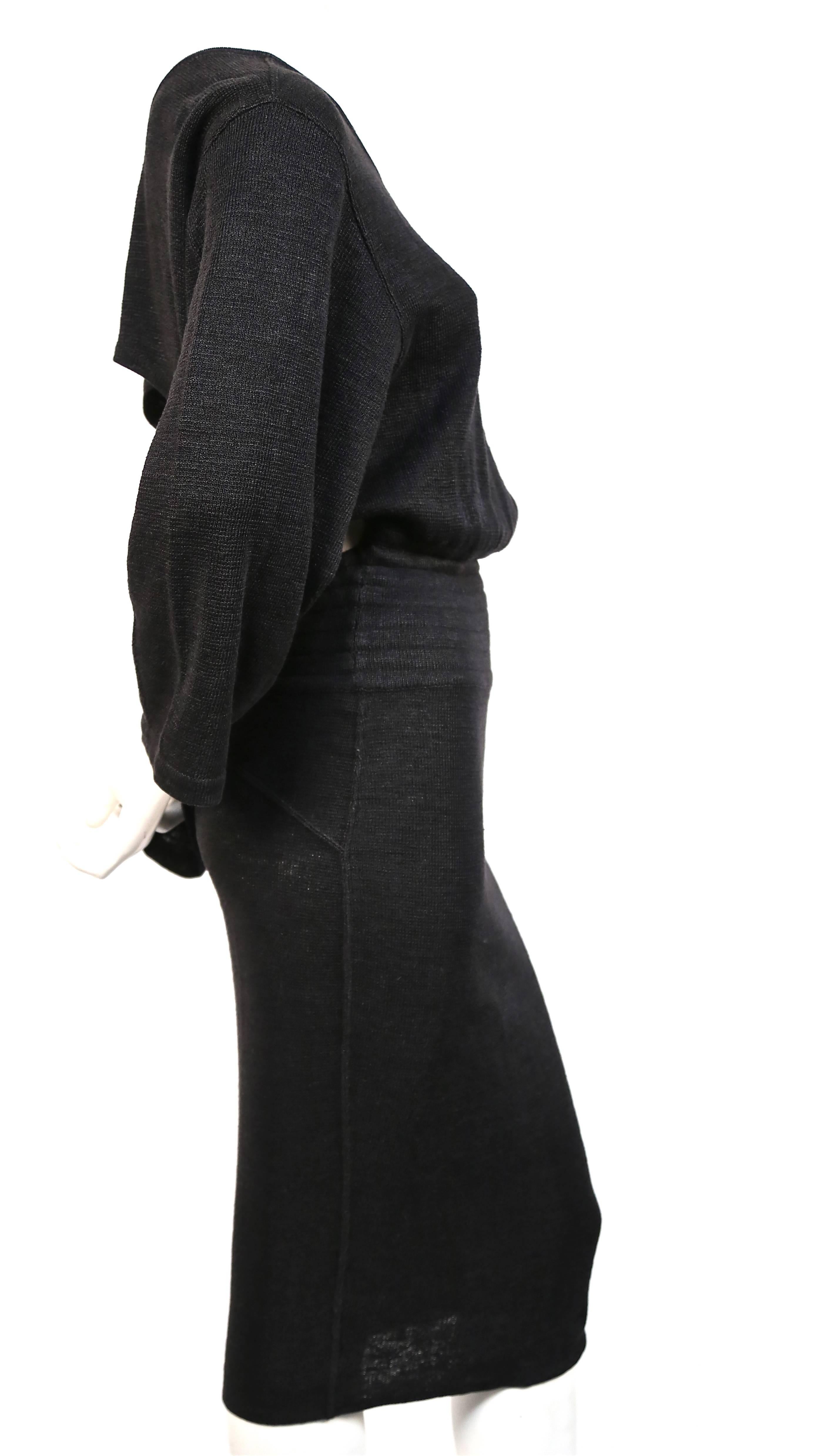 Very rare soft black linen dress with elasticized waist and cut out back from Azzedine Alaia dating to the 1980's. Size 'S'. Approximate measurements: drop shoulder 20