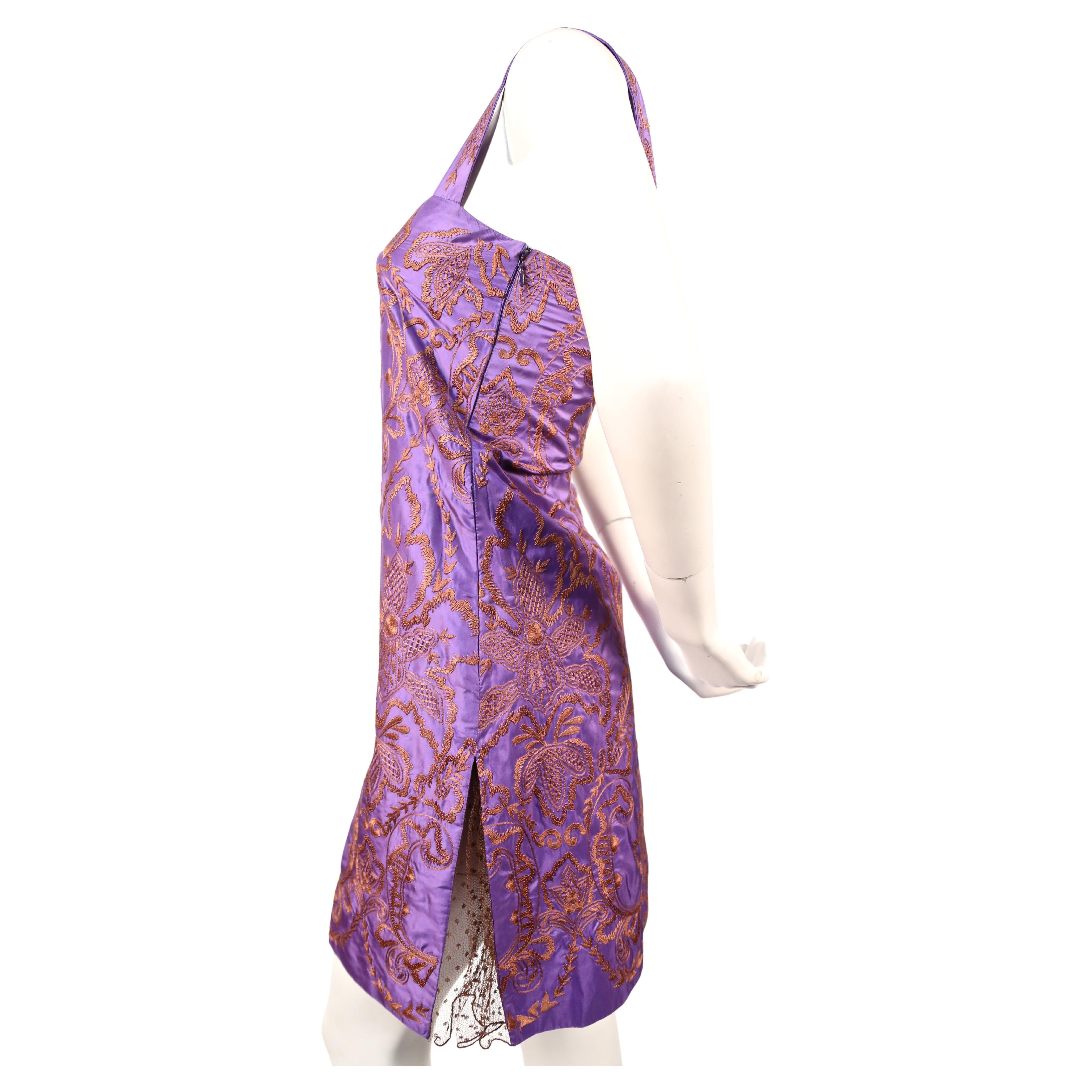 Rich purple silk dress with golden orange hand embroidery and brown tulle designed by Valentino dating to the early 1990's. Fits a size 0 or 2. Approximate measurements: bust 31