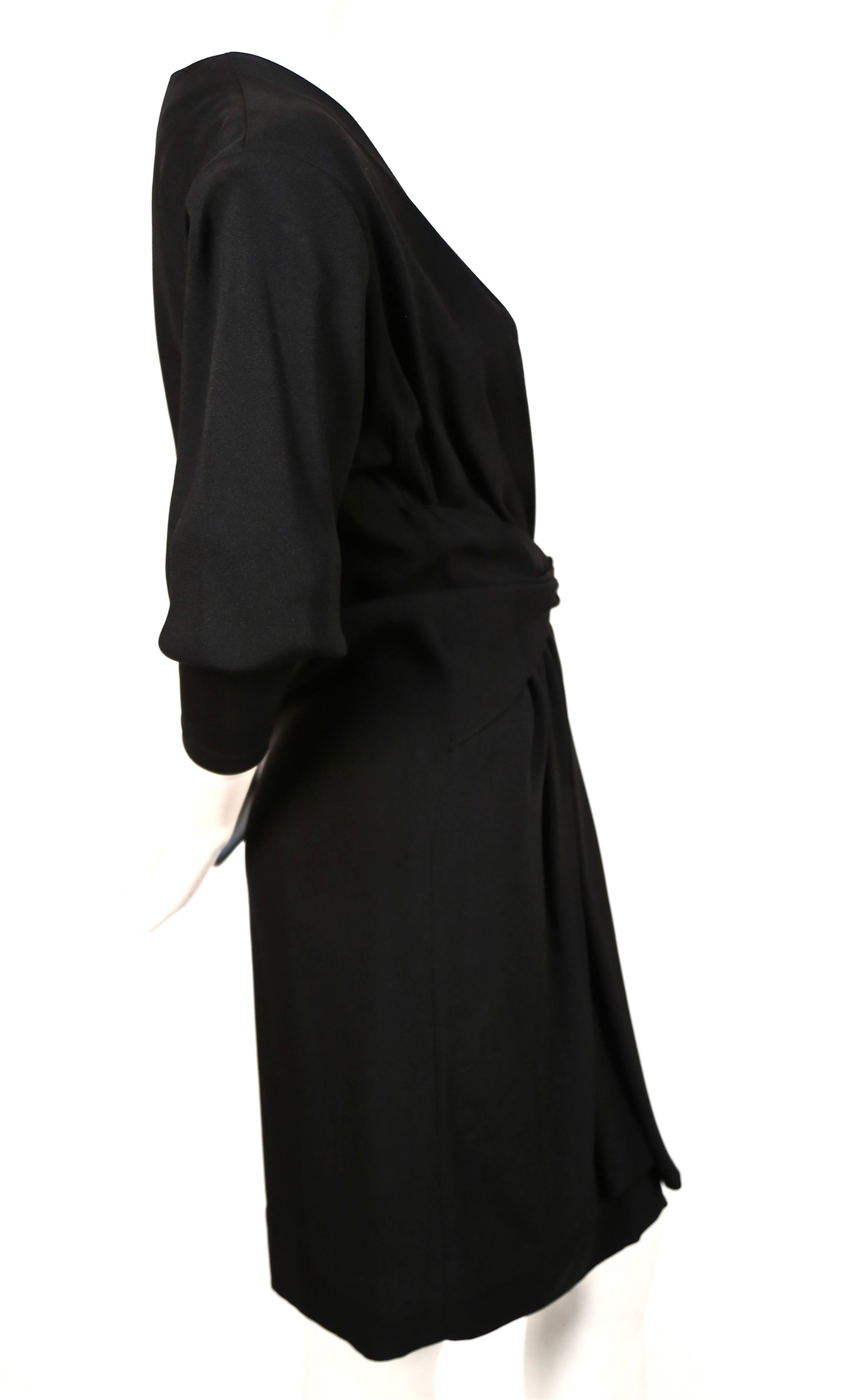 Black 1970's SAINT LAURENT black dress with plunging neckline and draped 