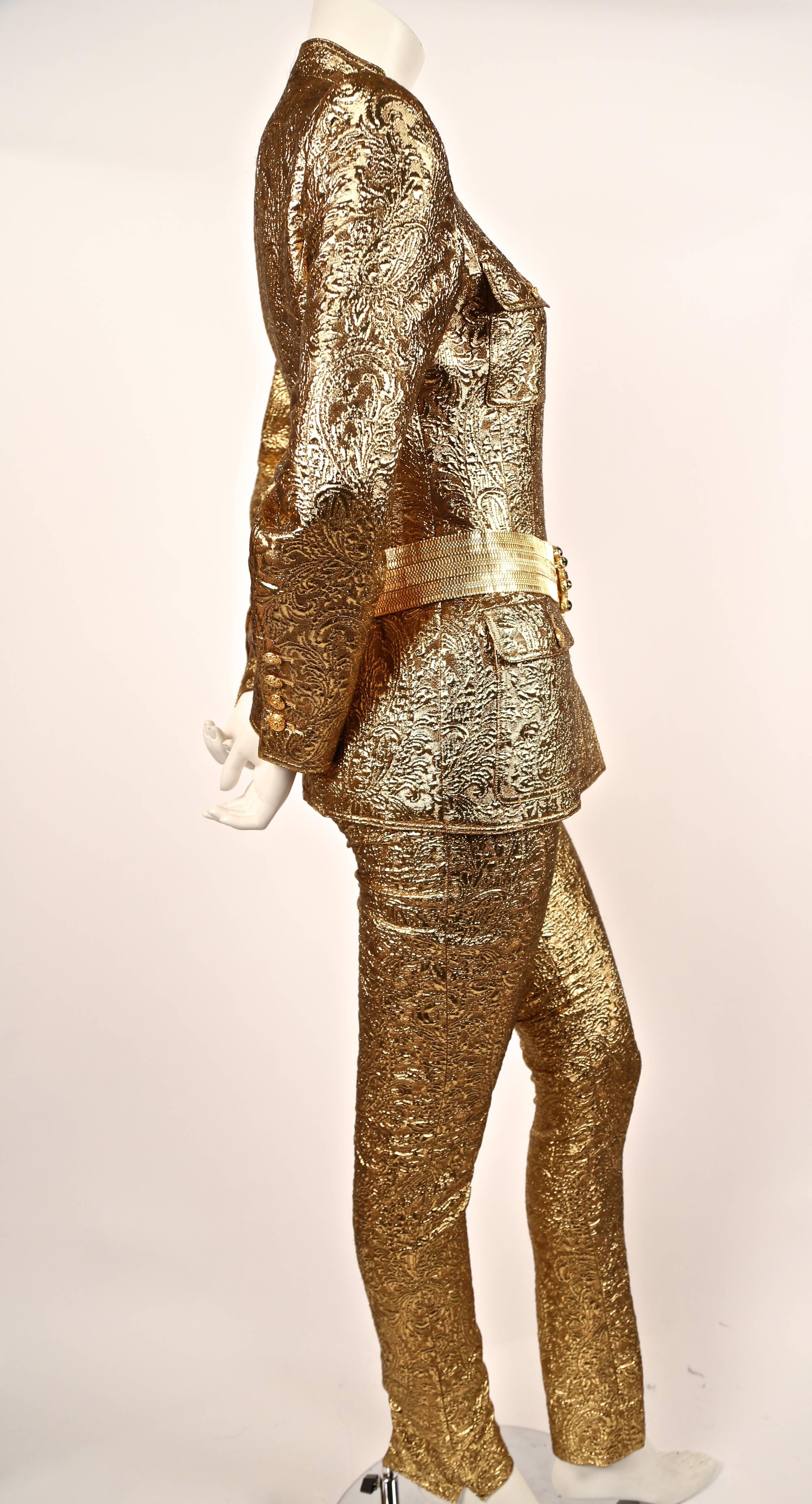 Very rare gold metallic matelasse Lesage quilted suit with belt made of poured Gripoix glass from Chanel as seen on the runway and featured in the Chanel ad campaign for fall of 1996. Approximate measurements for jacket: 14