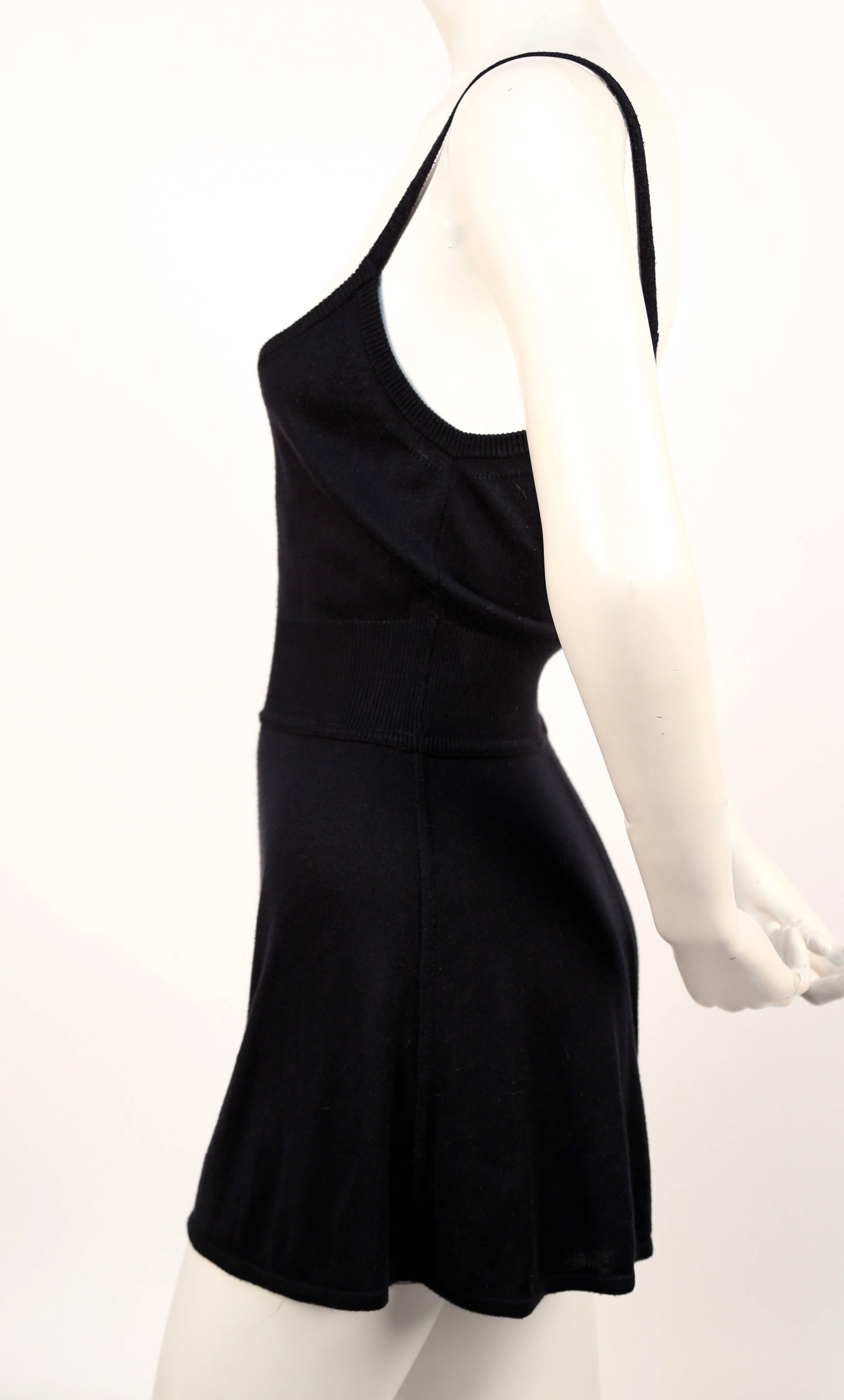 Black romper with set in woven waistband designed by Azzedine Alaia. French size 36 (best fits a FR 38 or tall FR 36). Approximate measurements: bust 30