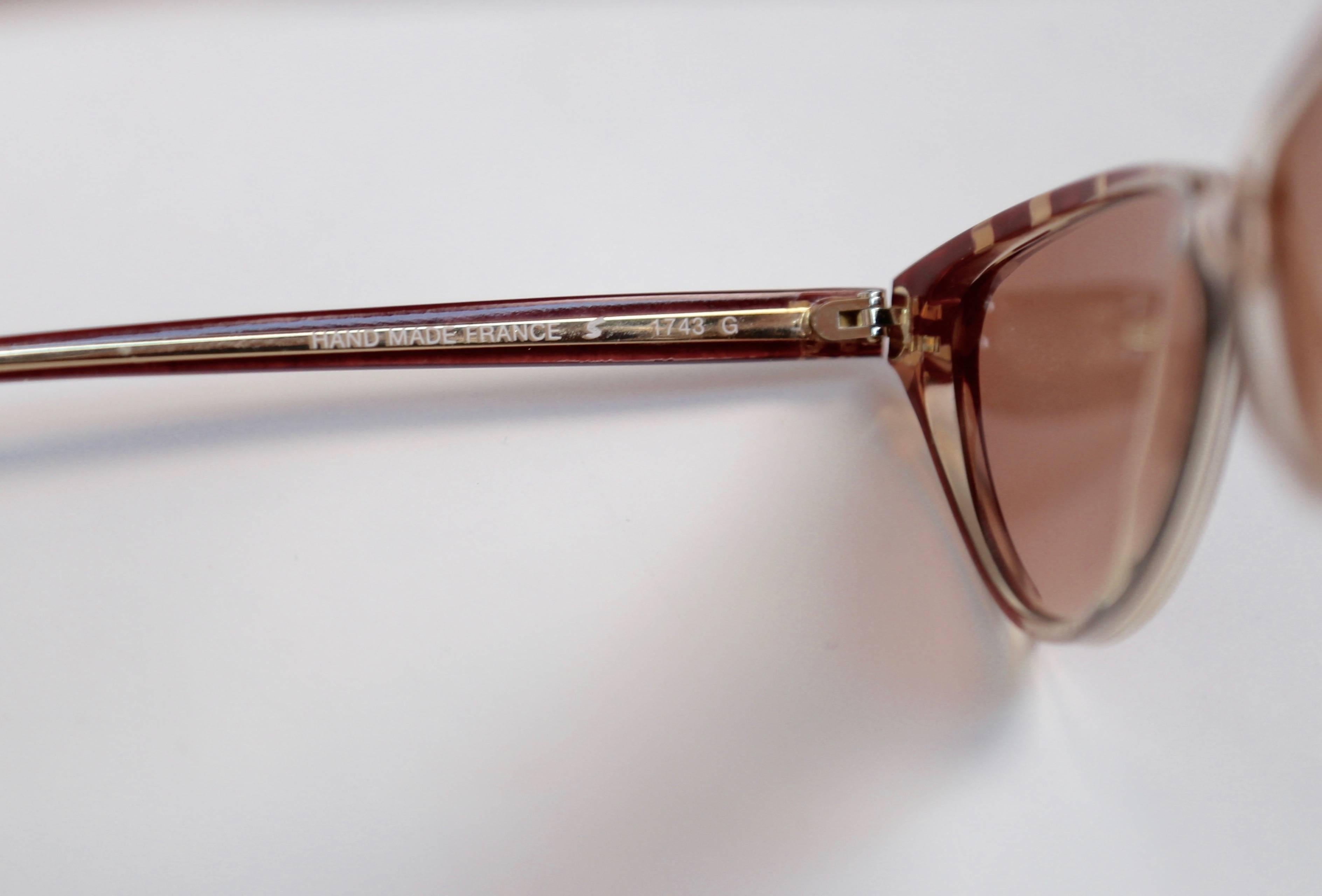 Brown Nina Ricci rose cat-eye sunglasses with gold accents, 1980s
