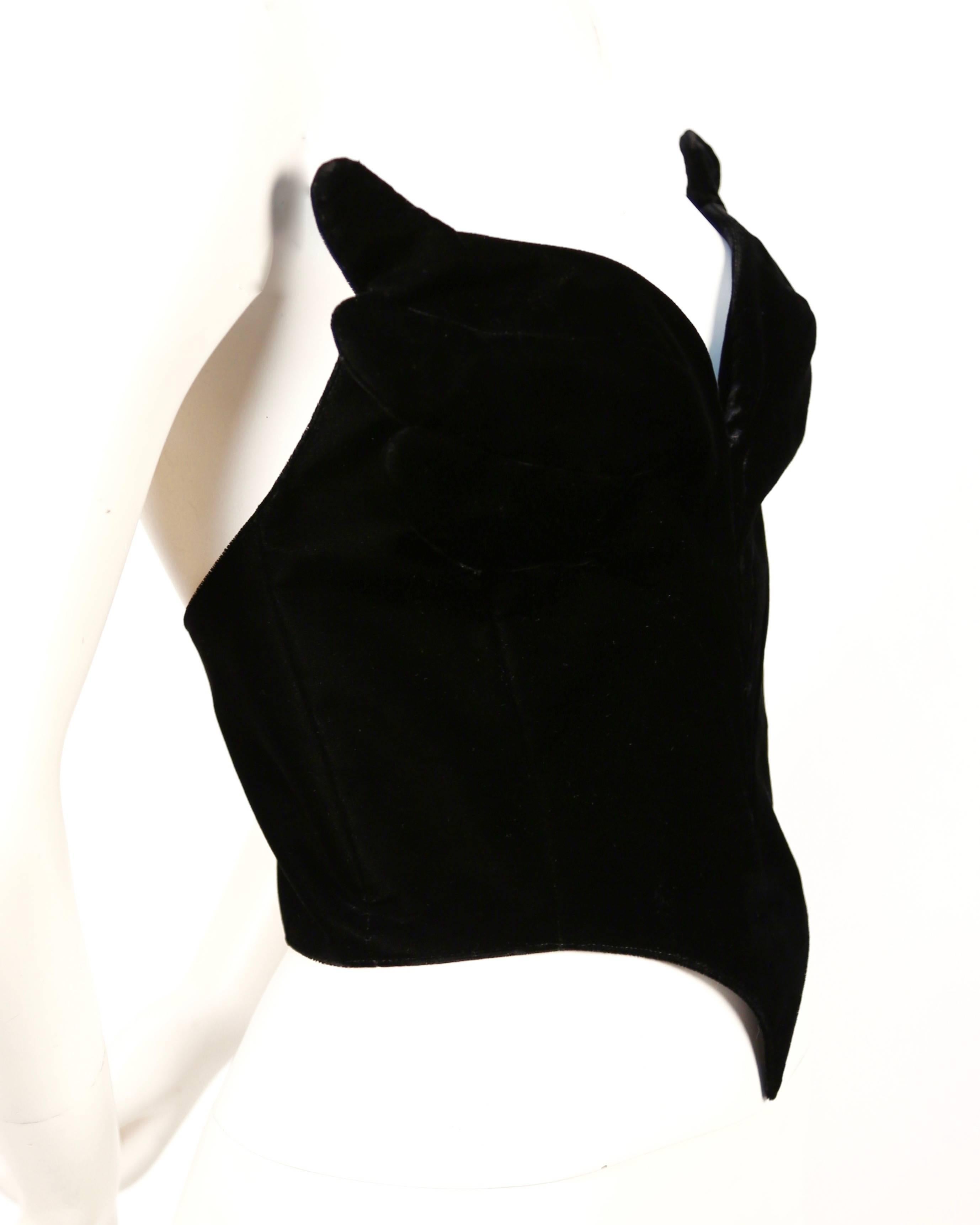 Very rare jet black velvet winged bustier designed by Thierry Mugler dating to 1988. Labeled a French size 38. Bustier measures approximately 33