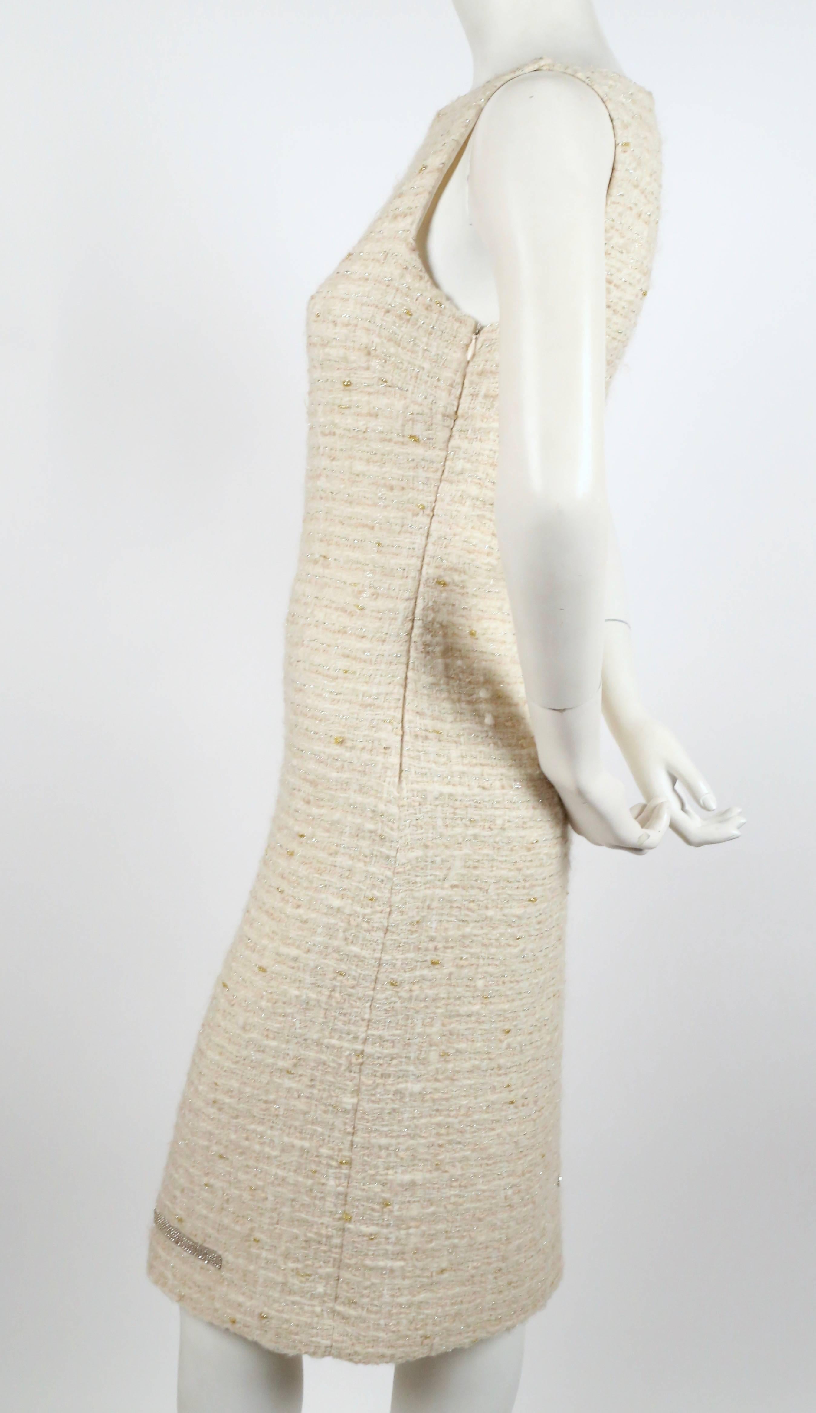 Classic cream boucle sheath dress with unique chainmail detail designed by Genny. Italian size 42. Approximate measurements: bust 33-34