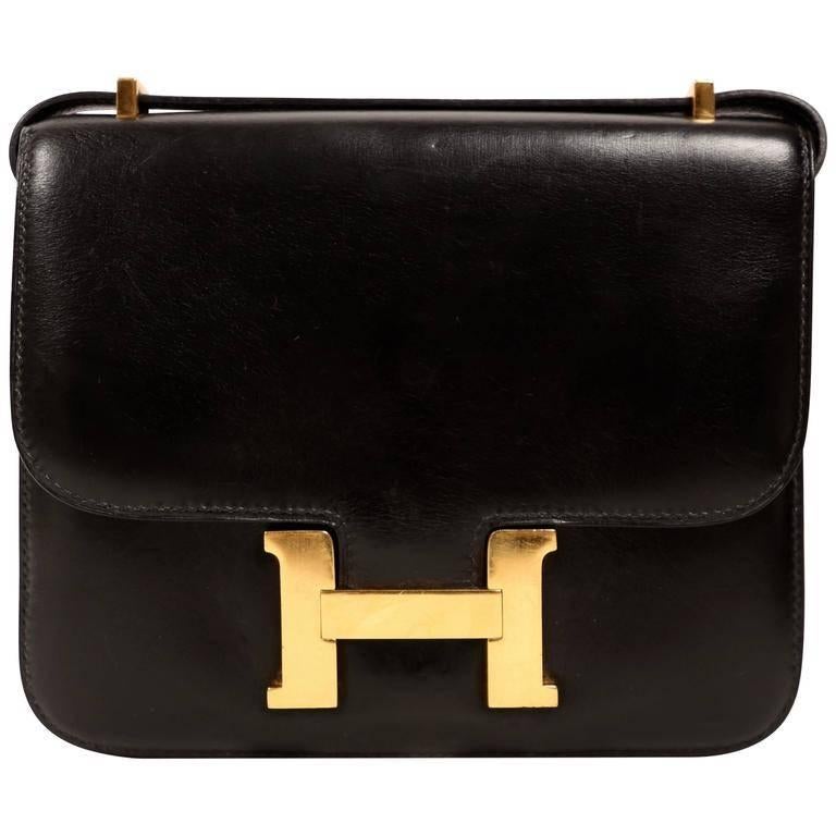 Jet black 18cm Hermes Constance with gold hardware dating to 1990.  The Constance takes an Hermes craftsman over 60 hours to construct, which is even more time it takes to make a Birkin. You will not find anything more well made. Bag is made out of
