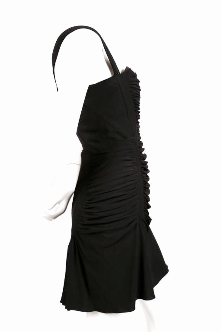 Jet black shirred dress with open back and intricate topstitching from Azzedine Alaia. Very clever construction at back. Dress best fits a US size 6. Approximate measurements: bust 34