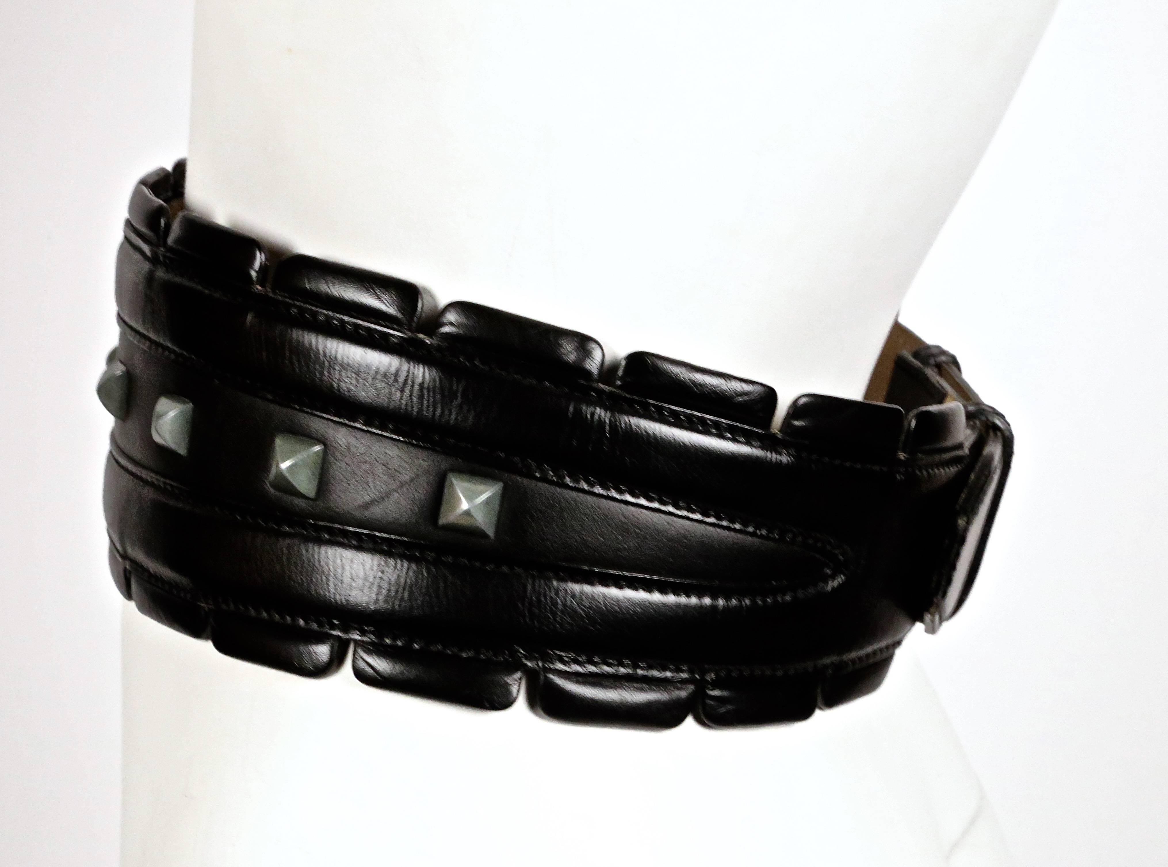 Very rare jet black leather belt with silver toned pyramid studs from Azzedine Alaia dating as seen on the fall 1988 runway. Belt is labeled a French 75 and ideally fits a 27-29
