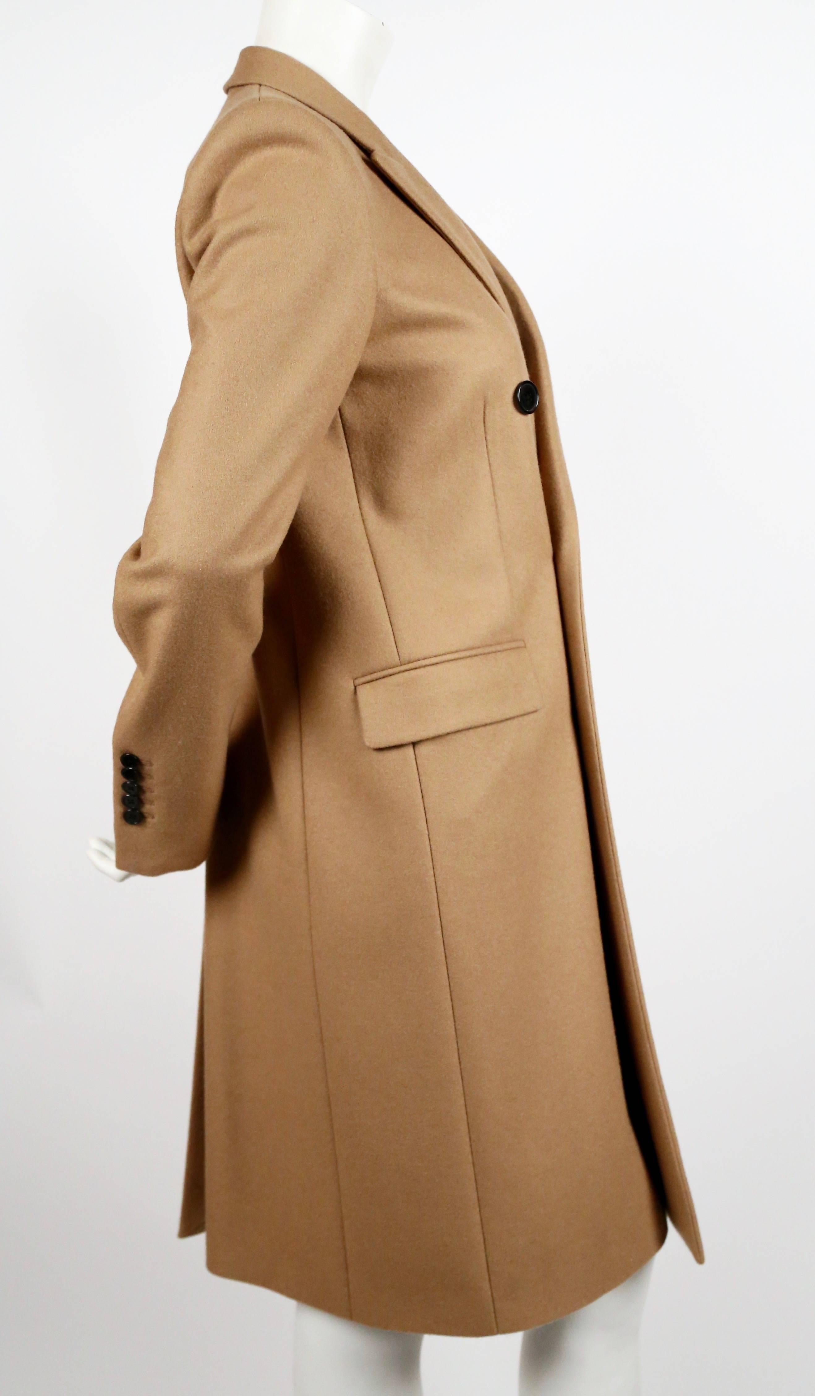 Camel double breasted wool coat from Saint Laurent designed by Hedi Slimane.
French size 38. Approximate measurement: shoulder along top 15.5
