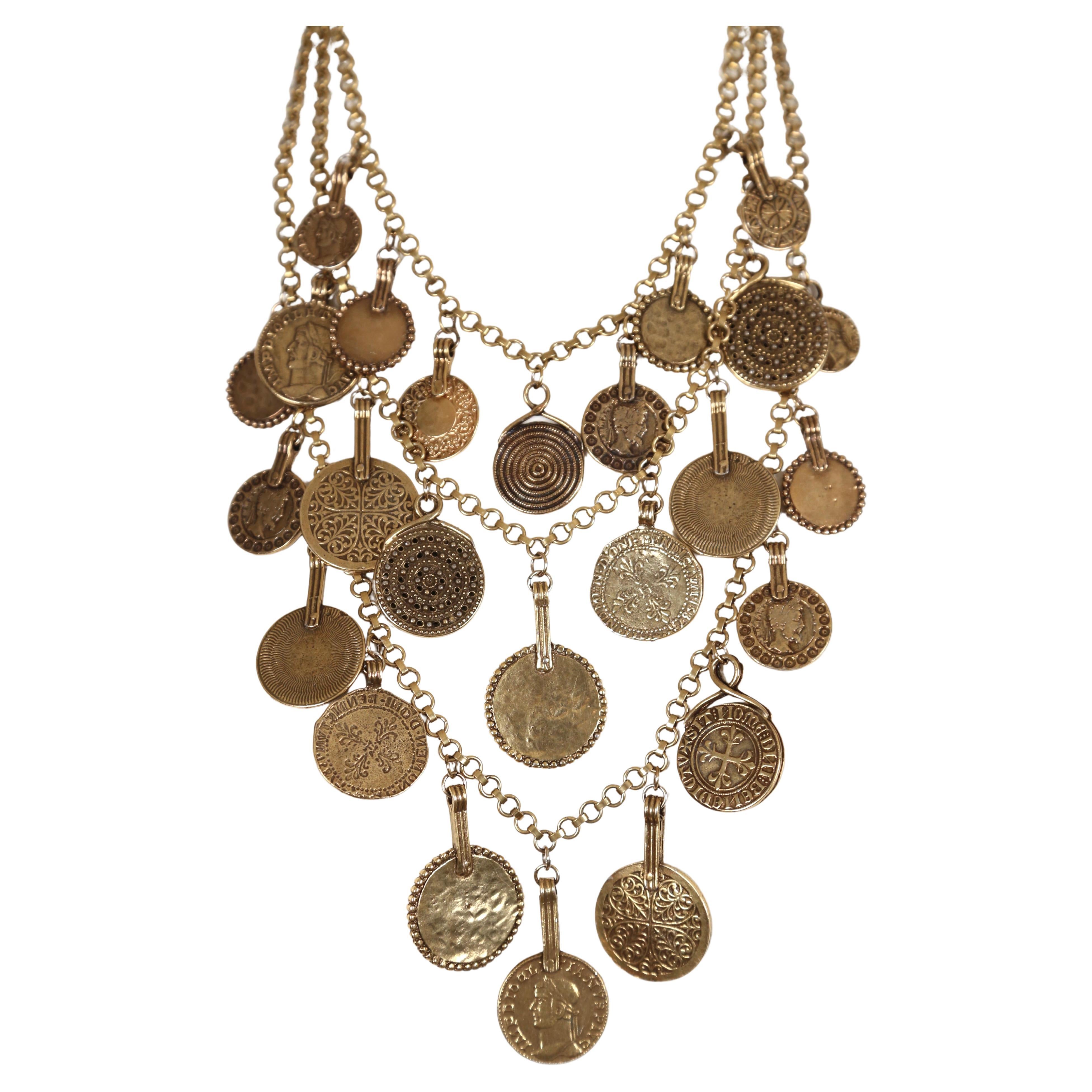 Very rare, triple layered ancient Byzantine style coin necklace from Yves Saint Laurent dating to spring of 1977 as seen on the runway and documented in several magazine editorials. Approximate measurements of inner strand is 18