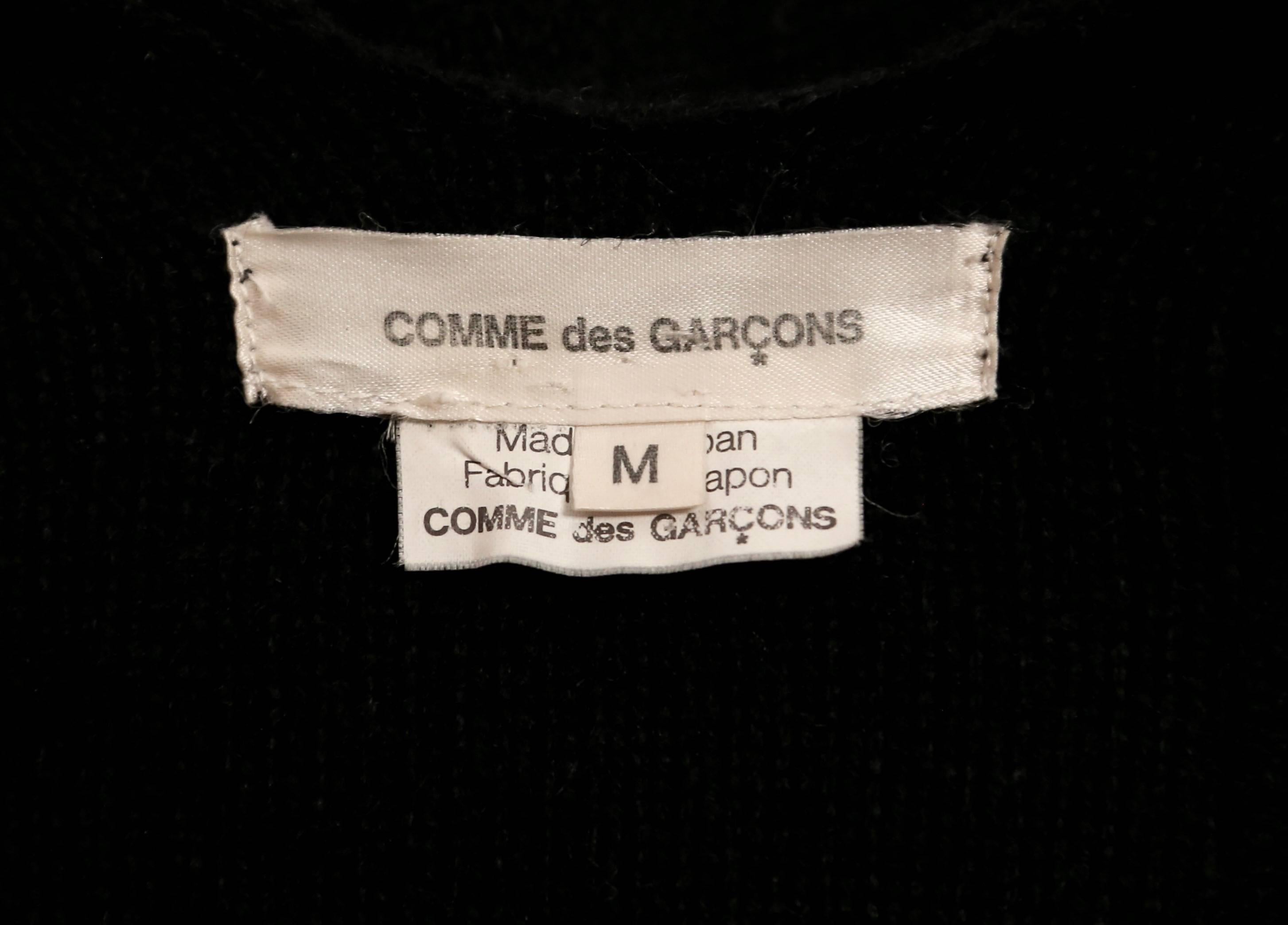 Black COMME DES GARCONS asymmetrical black wool wrap sweater with raw edges