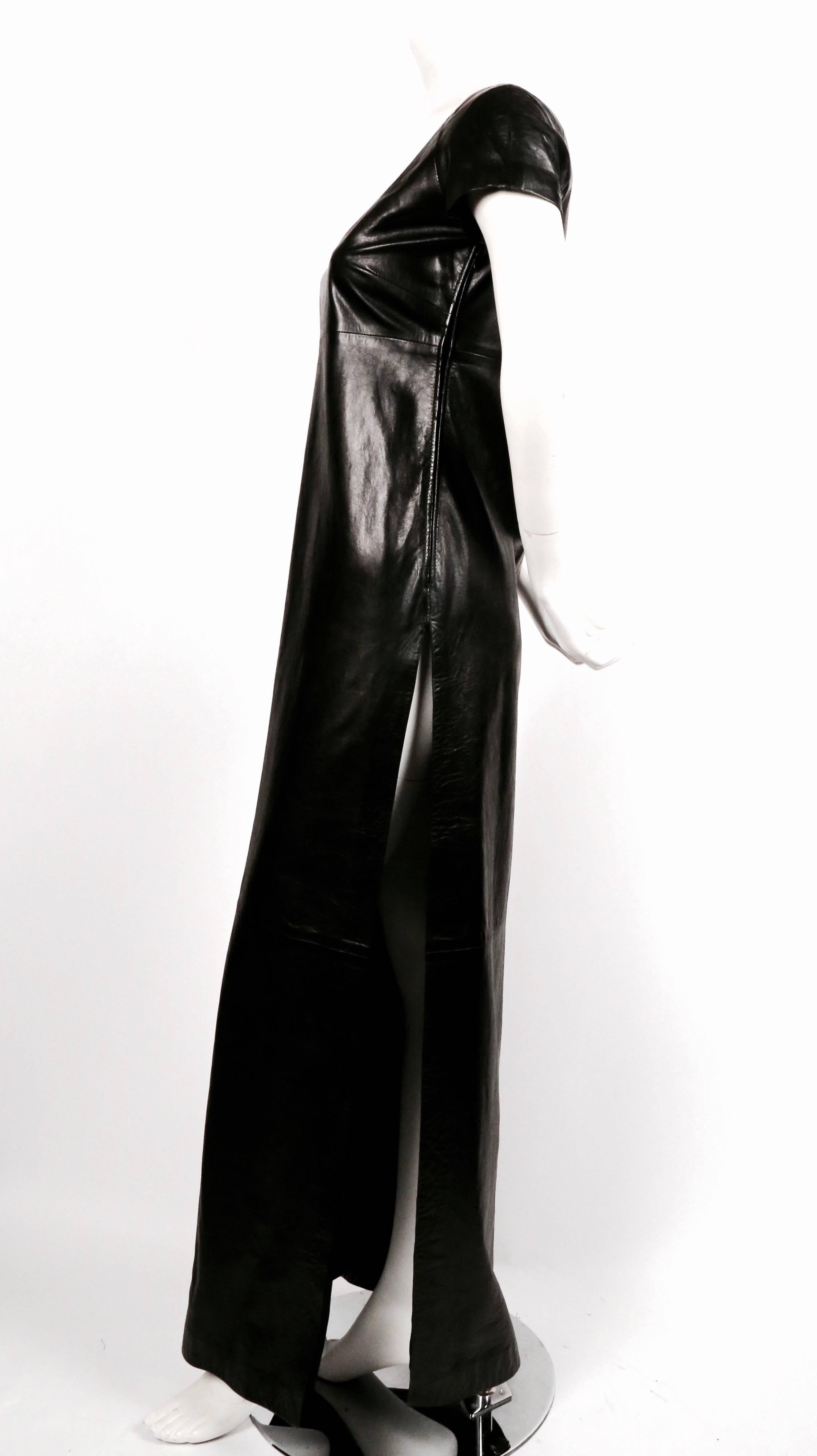 Very rare jet black lambskin leather dress with very high side slit from Tom Ford for Gucci dating to the late 1990's. Labeled an Italian size 42. Fits a size 2 or 4. Approximate measurements; bust 34", waist 34", hips 35" and length