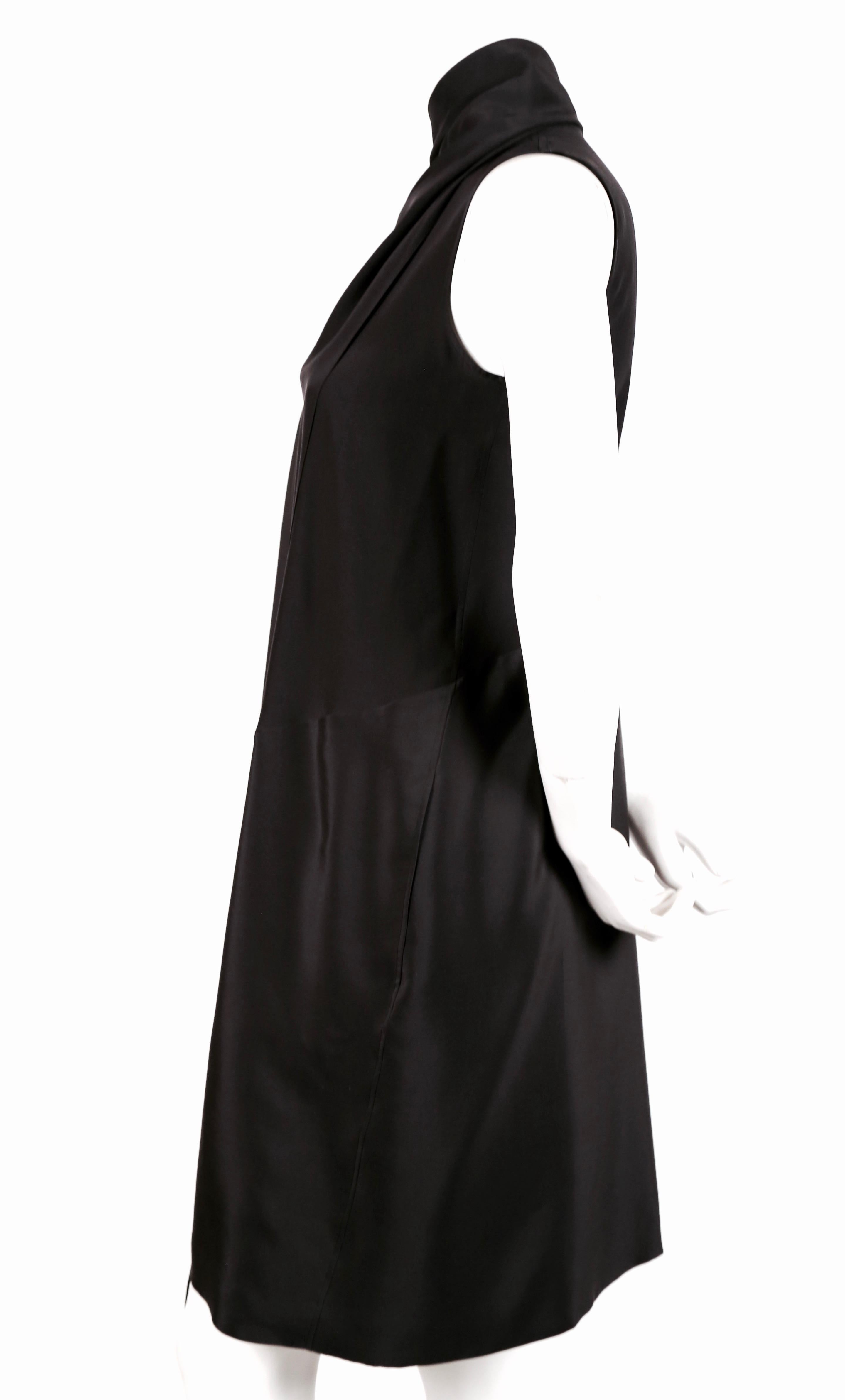 Dark navy blue silk dress with draped wrap scarf neckline designed by Phoebe Philo for her first collection for Celine - Resort 2010. French size 36. Measures approximately: 14
