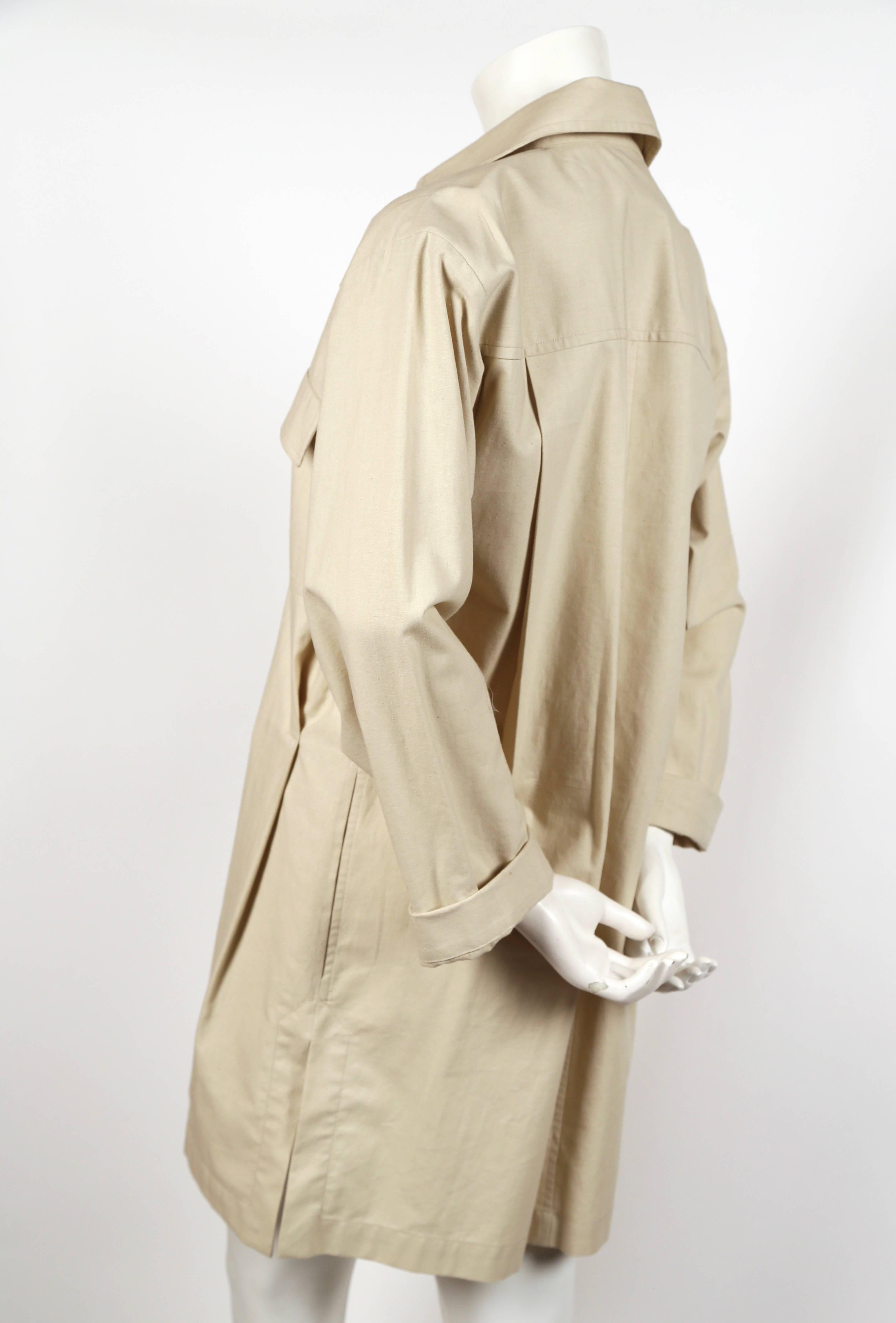 Unworn tan cotton safari tunic dress from Yves Saint Laurent dating to the 1980's. French size 36. Measures approximately: 18