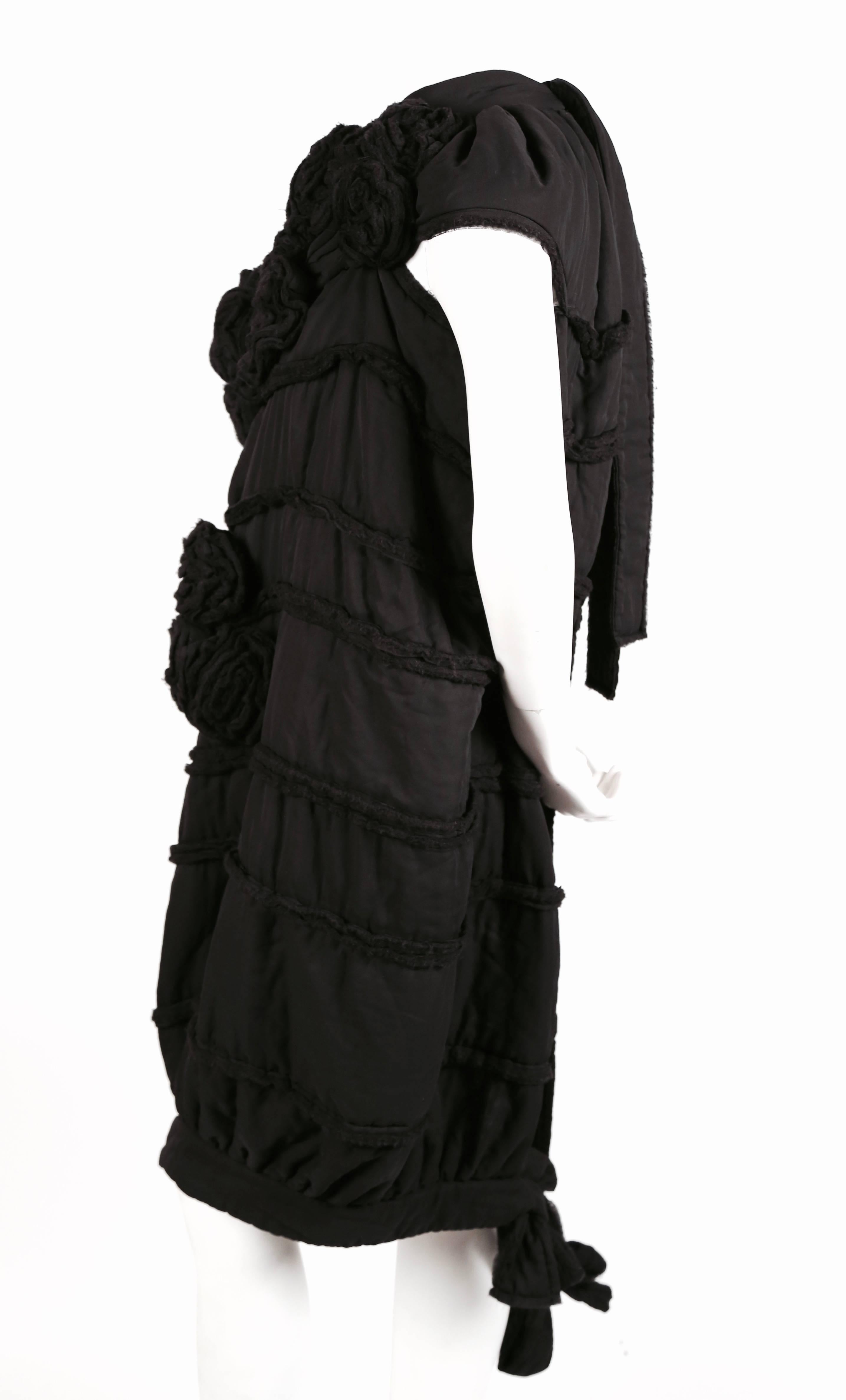 Black 2006 COMME DES GARCONS 'tao' black dress with rosettes