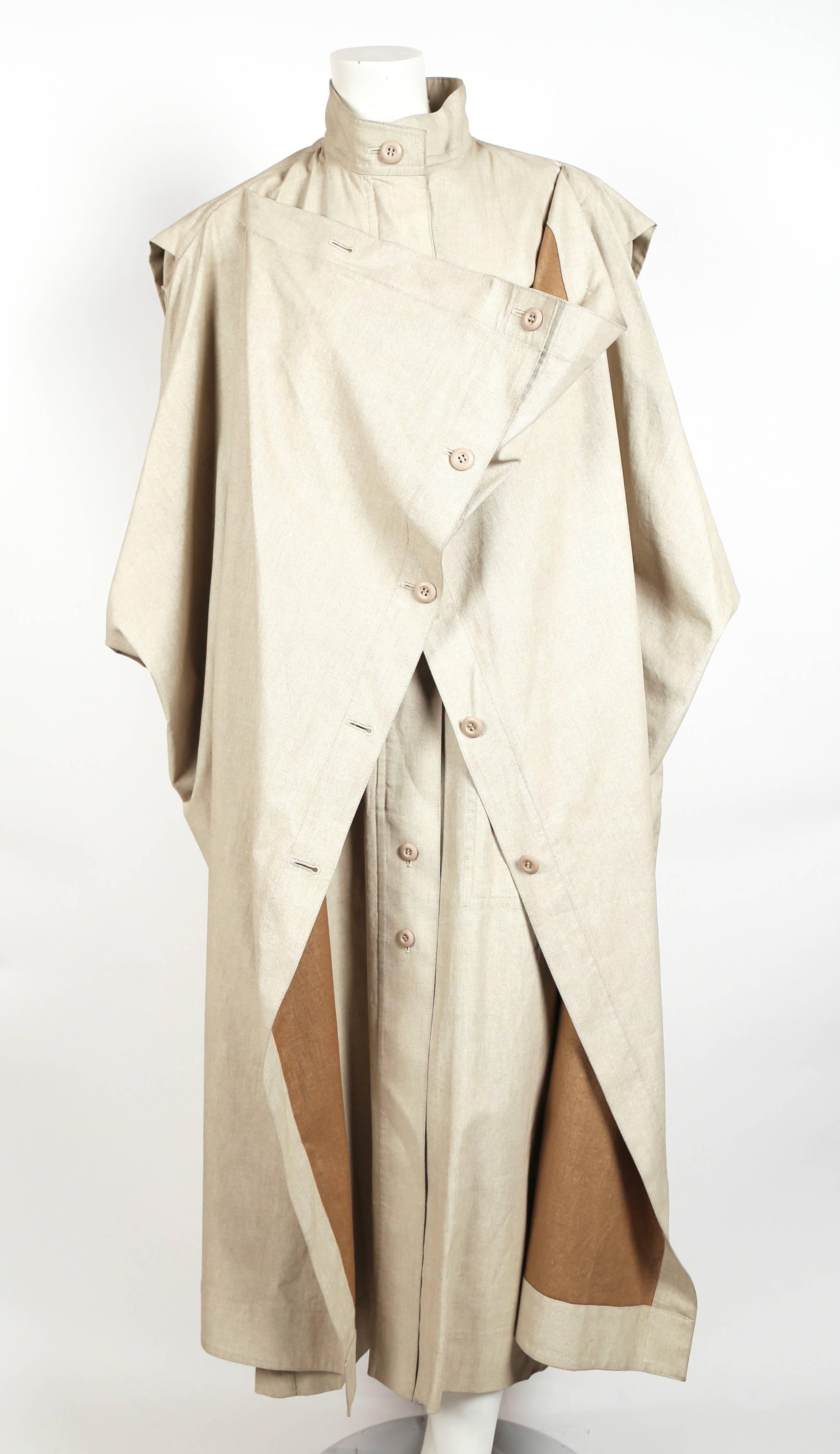 Very rare 1980's tan oversized draped coat designed by Issey Miyake dating to the 1980's. Can be worn a number of ways. Labeled a size Medium, however this coat will fit many sizes due to the oversized cut. Length is approximately 55-56
