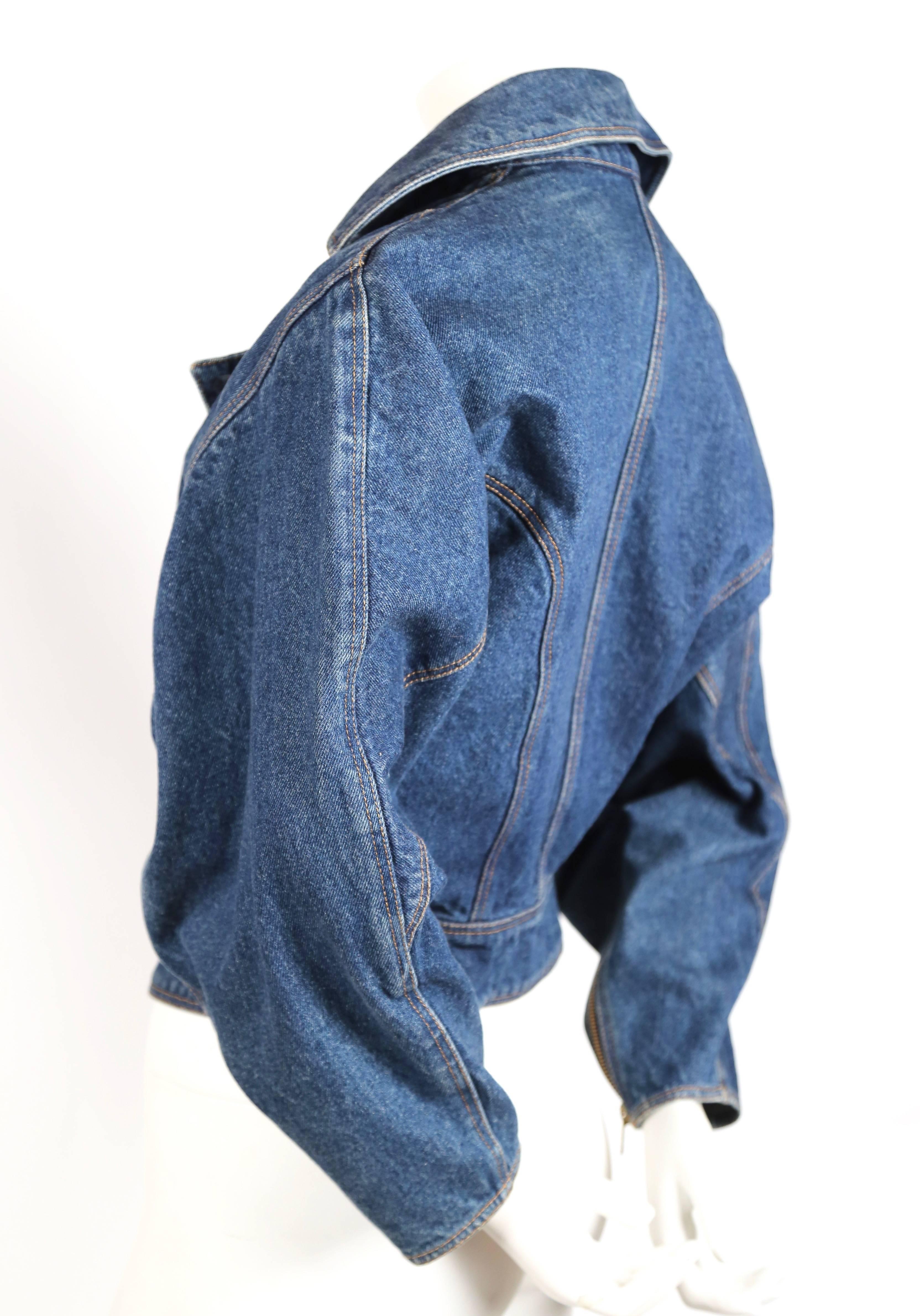 Documented denim jacket with brass zip closures from Azzedine Alaia dating to 1985. Labeled a French size 38". Approximate measurements: drop shoulder 18-18.5", waist 26-26.5", arm length from shoulder seam to cuff 20.5" and
