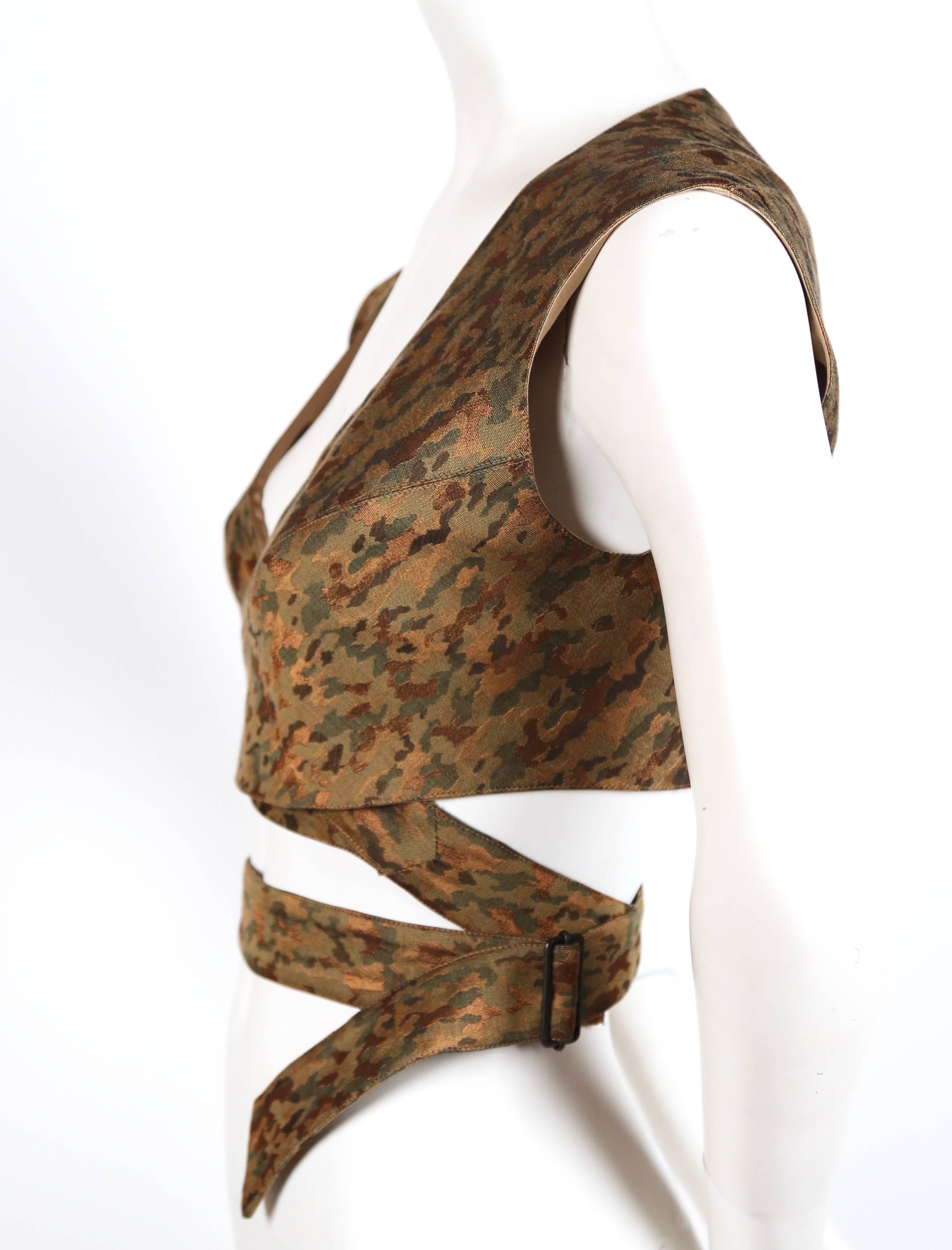 Very rare camouflage wrap bustier top designed by Azzedine Alaia dating to the 1990's. French size 40 however this would easily fit a FR 38. Darkened brass buckle closure at waist. Fabric content: 32% polyester 30% cotton  25% wool 12% viscose;
