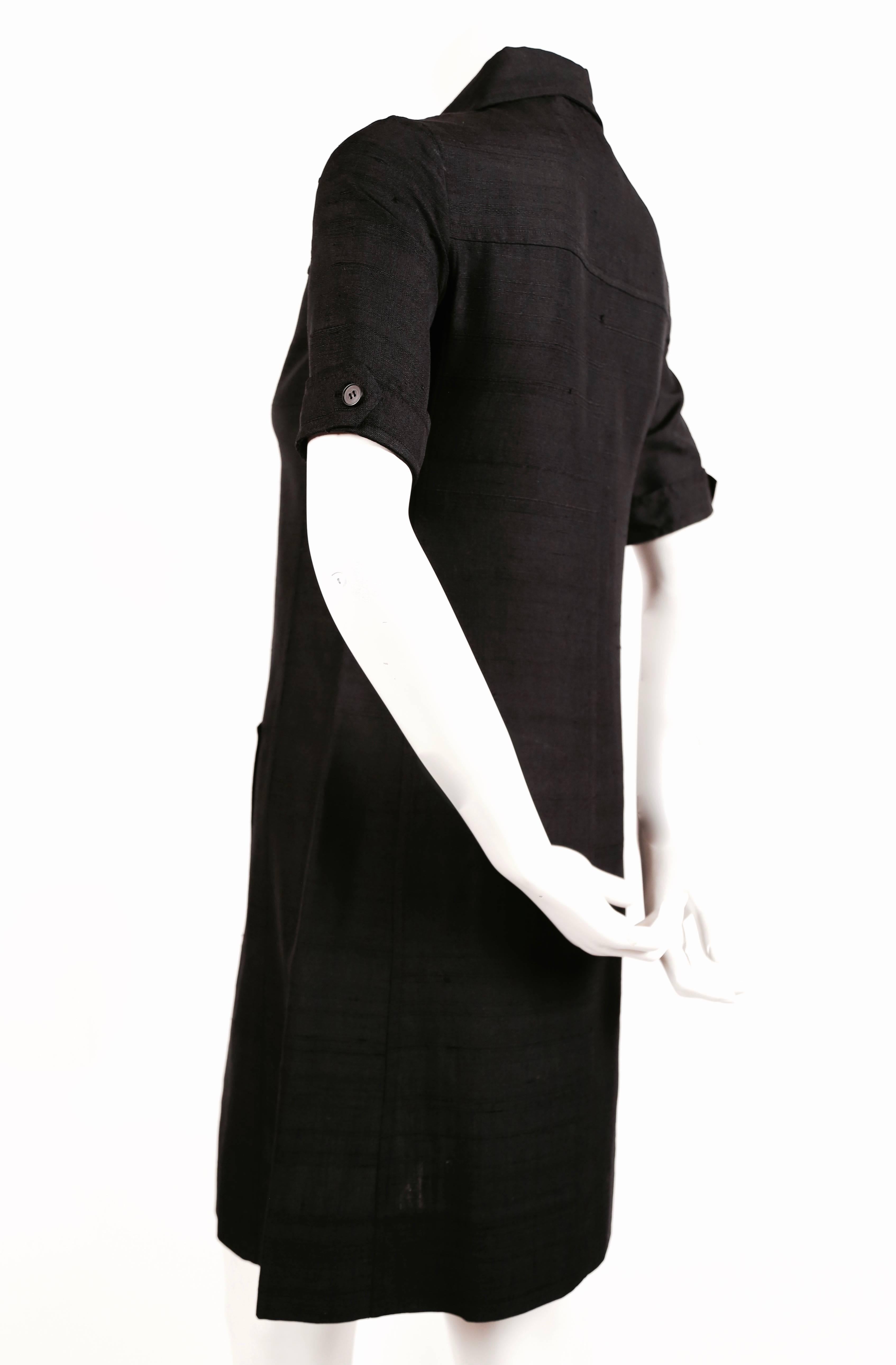 Jet black raw silk safari dress from Yves Saint Laurent dating to the 1960's. Labeled a size 34 which best fits a size 2 or 4. Approximate measurements: 14