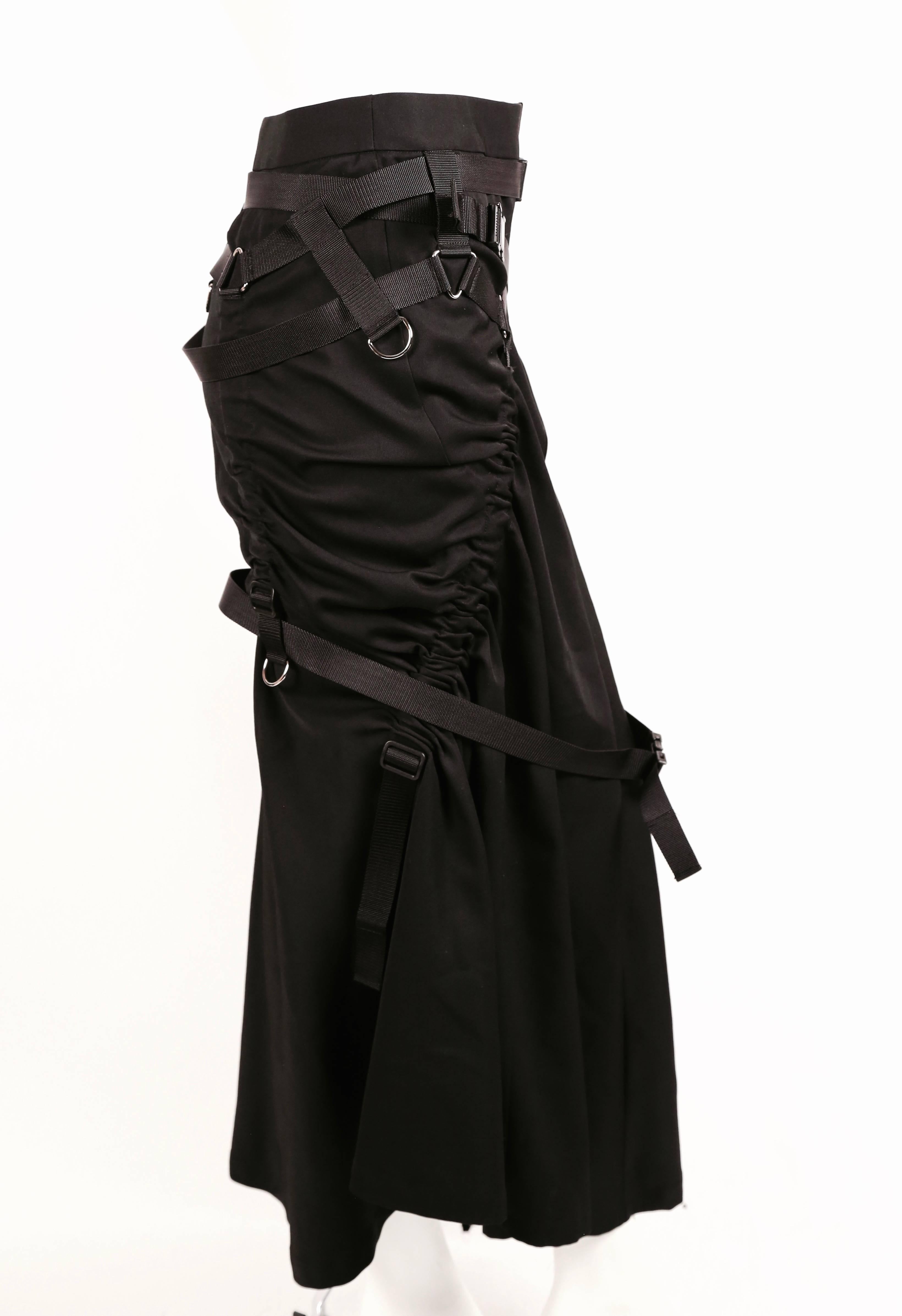 Jet black nylon parachute skirt designed by Junya Watanabe for Comme Des Garcons as seen on spring 2003 runway. Very flattering shape which can be adjusted numerous ways. Size S. Approximate measurements: waist 27.5