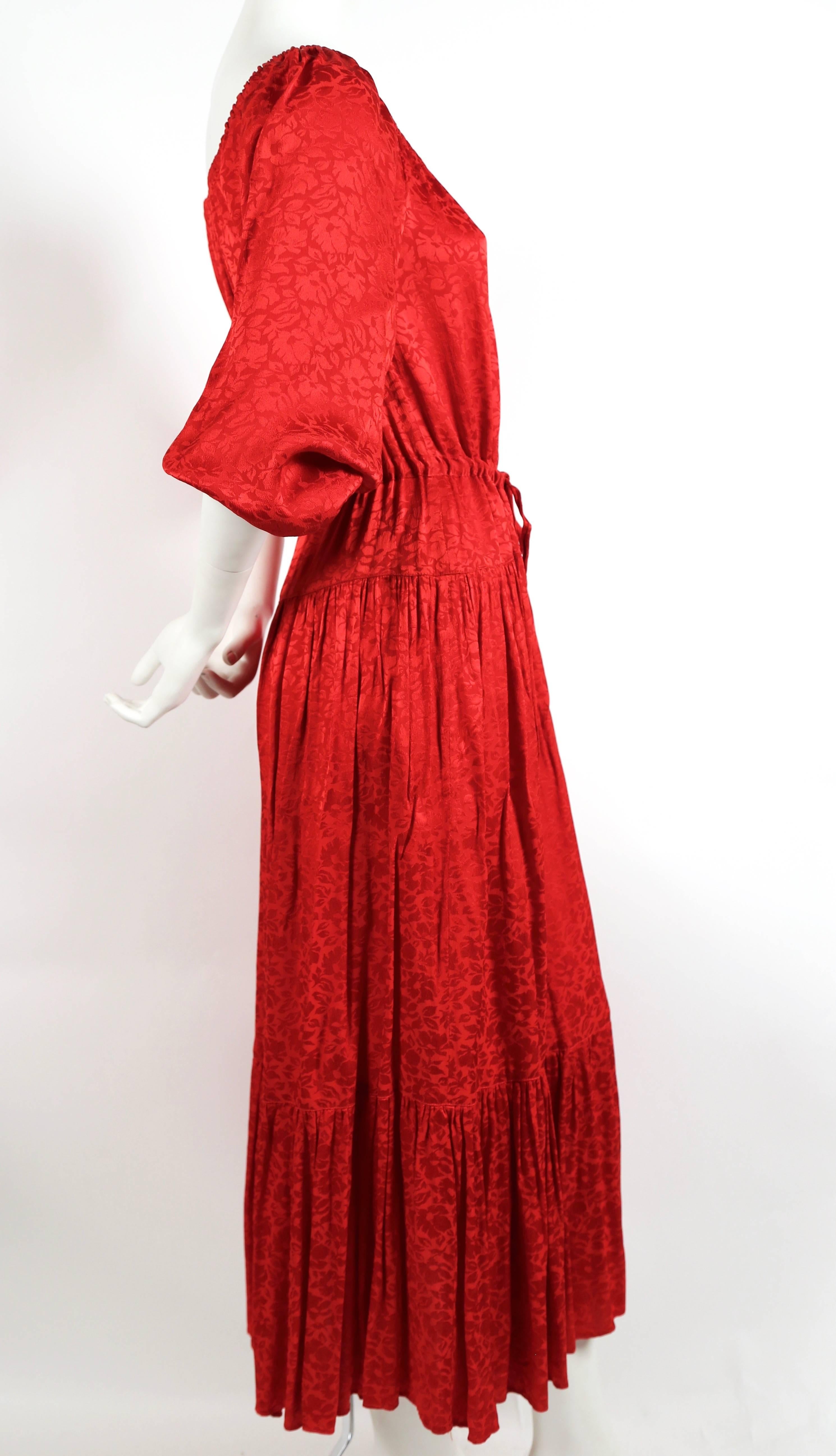Red floral damask dress designed by Ossie Clark for Radley dating to the 1970's. Labeled a UK 14 however this dress was not clipped on the US size 2 mannequin so it can fit many sizes. Approximate length measurement: 52