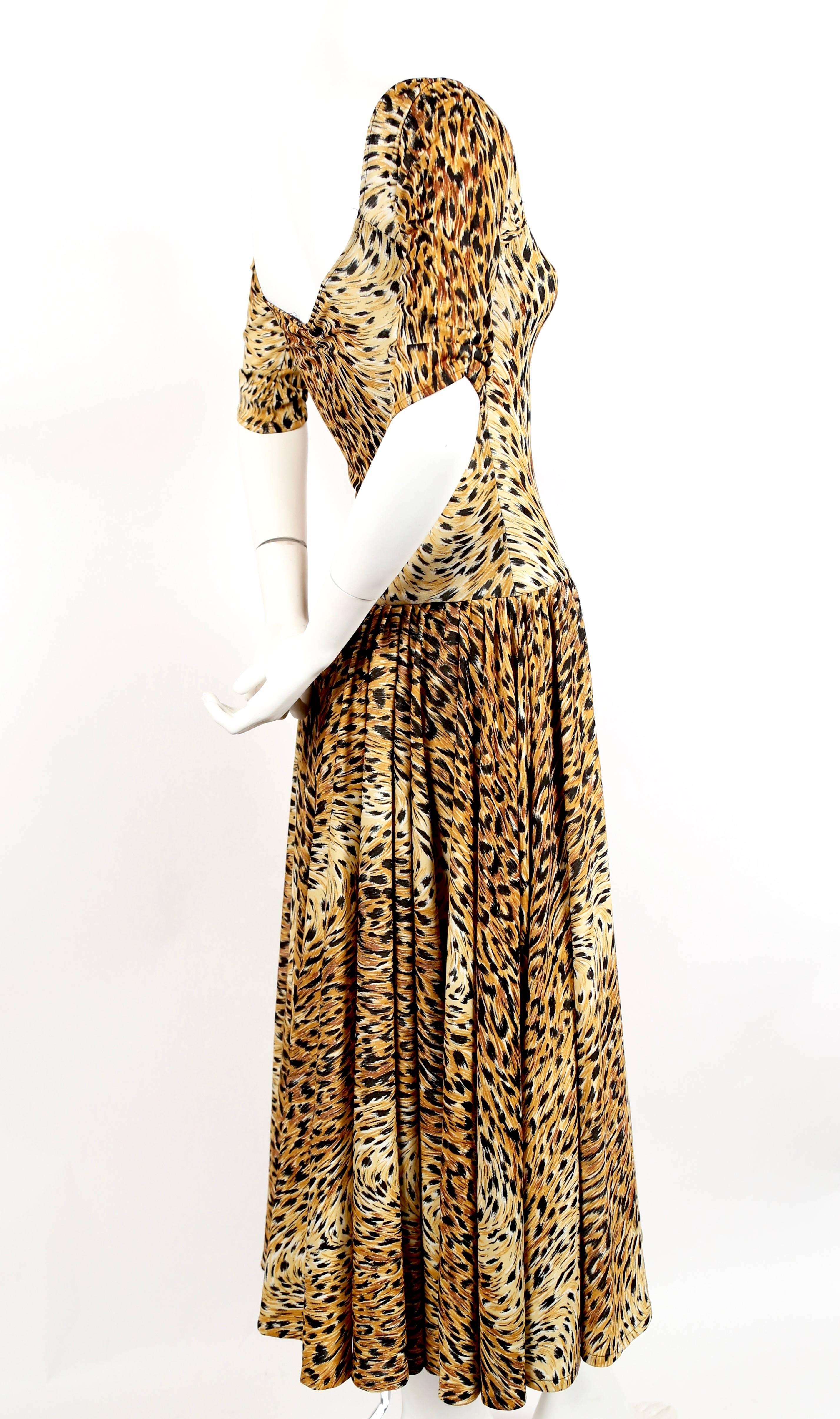 Leopard printed jersey dress with dropped waist from Norma Kamali dating to the 1970's.  Labeled a size 'M', which best fits a US 2-6. Approximate measurements (unstretched): bust 28