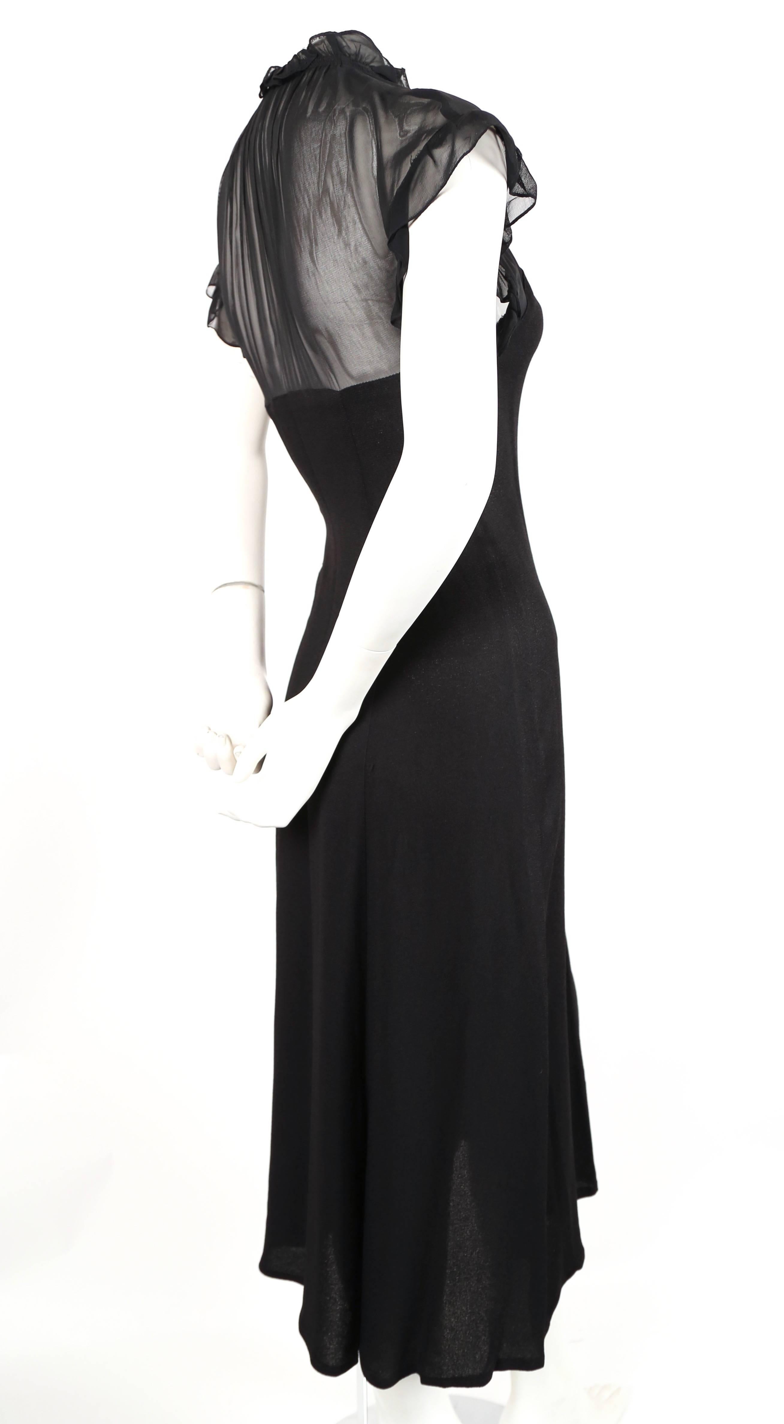 Black moss crepe dress with sheer neckline and button front designed by Radley dating to the 1970's. Beautiful sweetheart neck. This dress is commonly attributed to Ossie Clark. UK size 10. Fits a US 4. Approximate measurements (unstretched): bust