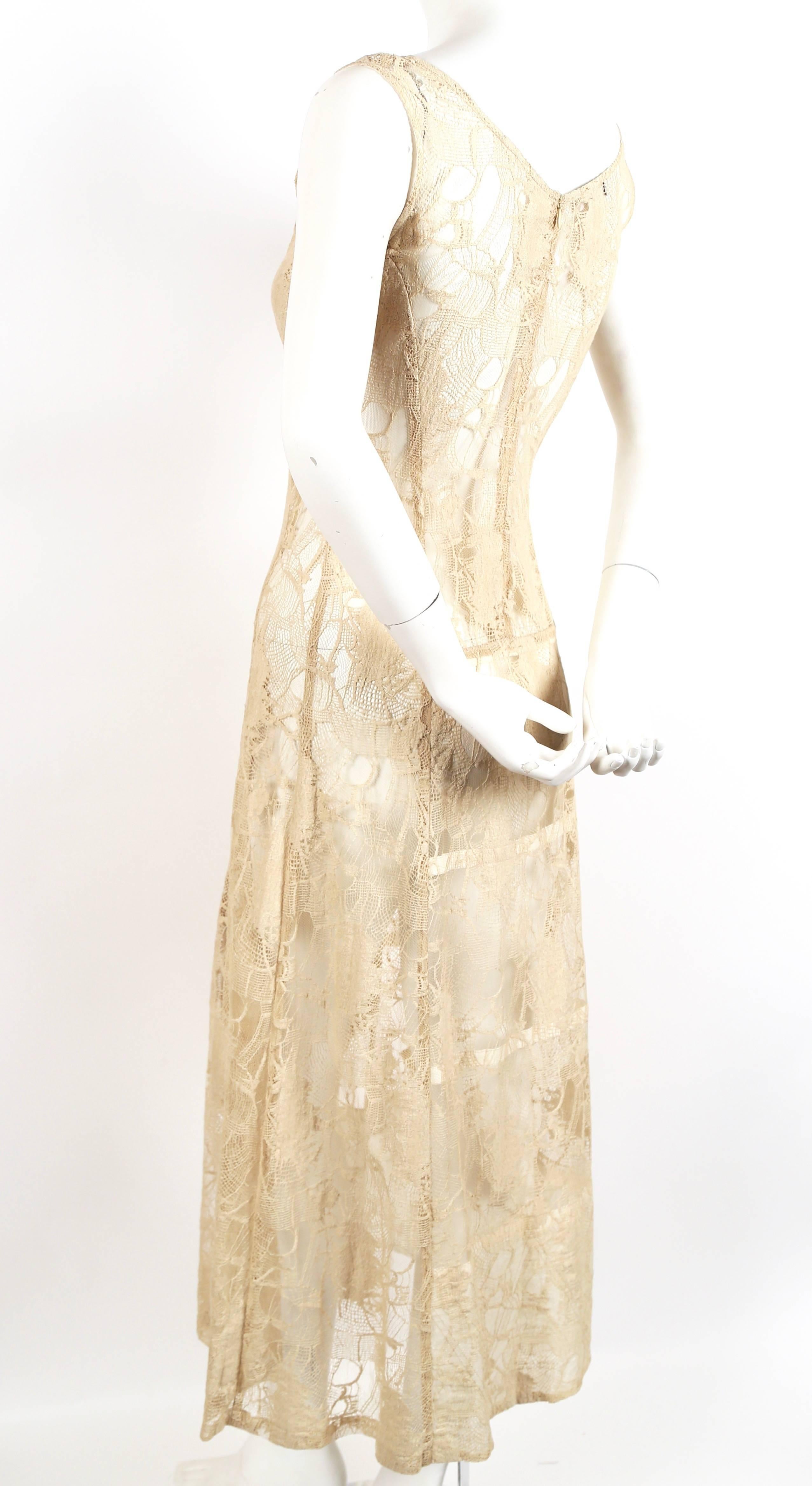 Beautiful cream lace semi sheer gown with very unique paneling from Dries Van Noten dating to the 1990's. Labeled a Belgian size 36. Approximate measurements: bust 33", waist 28", hips 40" and length is 50". Semi shallow arm