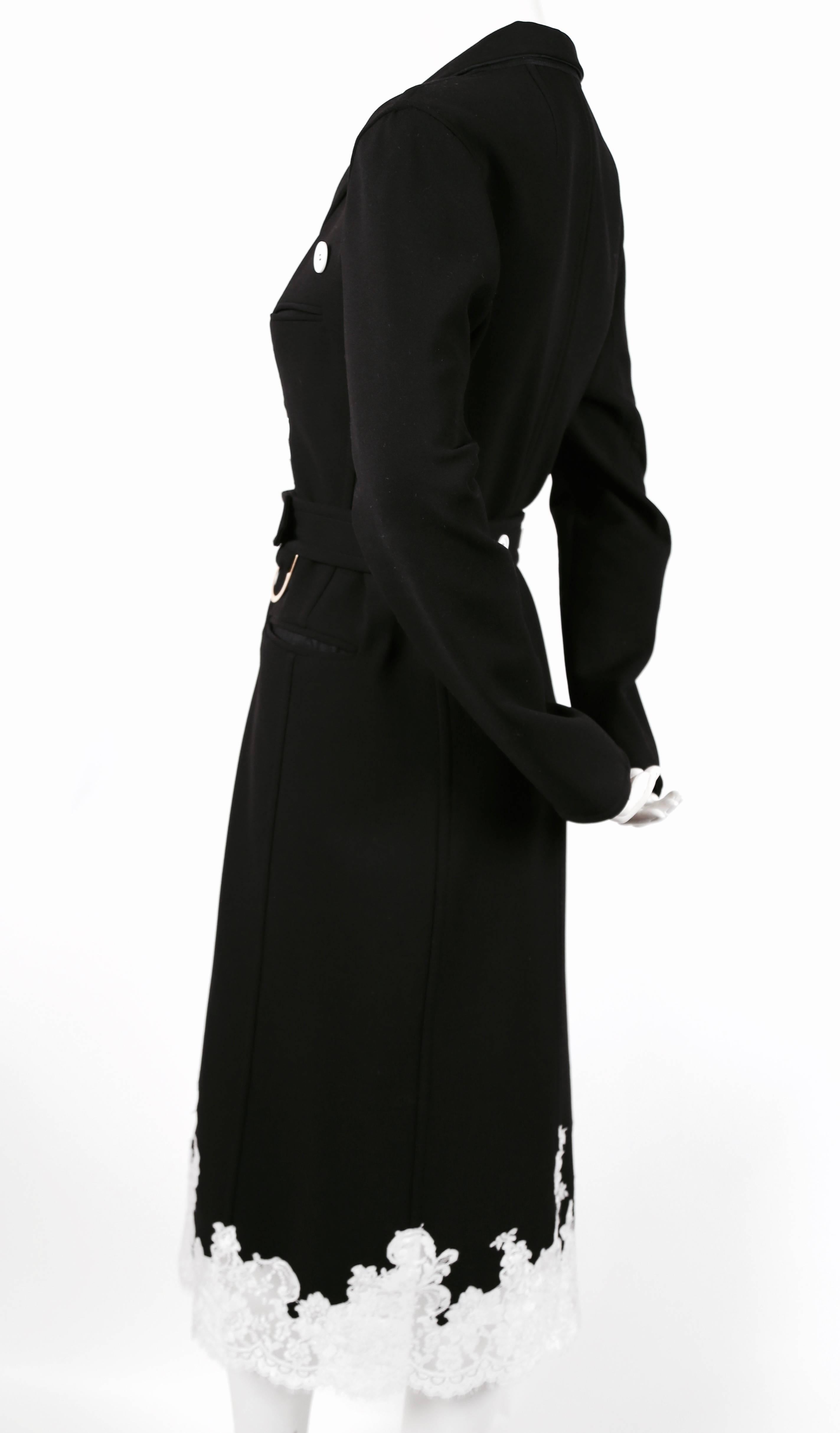 Black stretch wool trench with white lace trim designed by Phoebe Philo for Celine exactly as seen on the spring 2016 runway. French size 38. Approximate measurements: shoulder 17", bust 36", waist 33" without belt and 30" with
