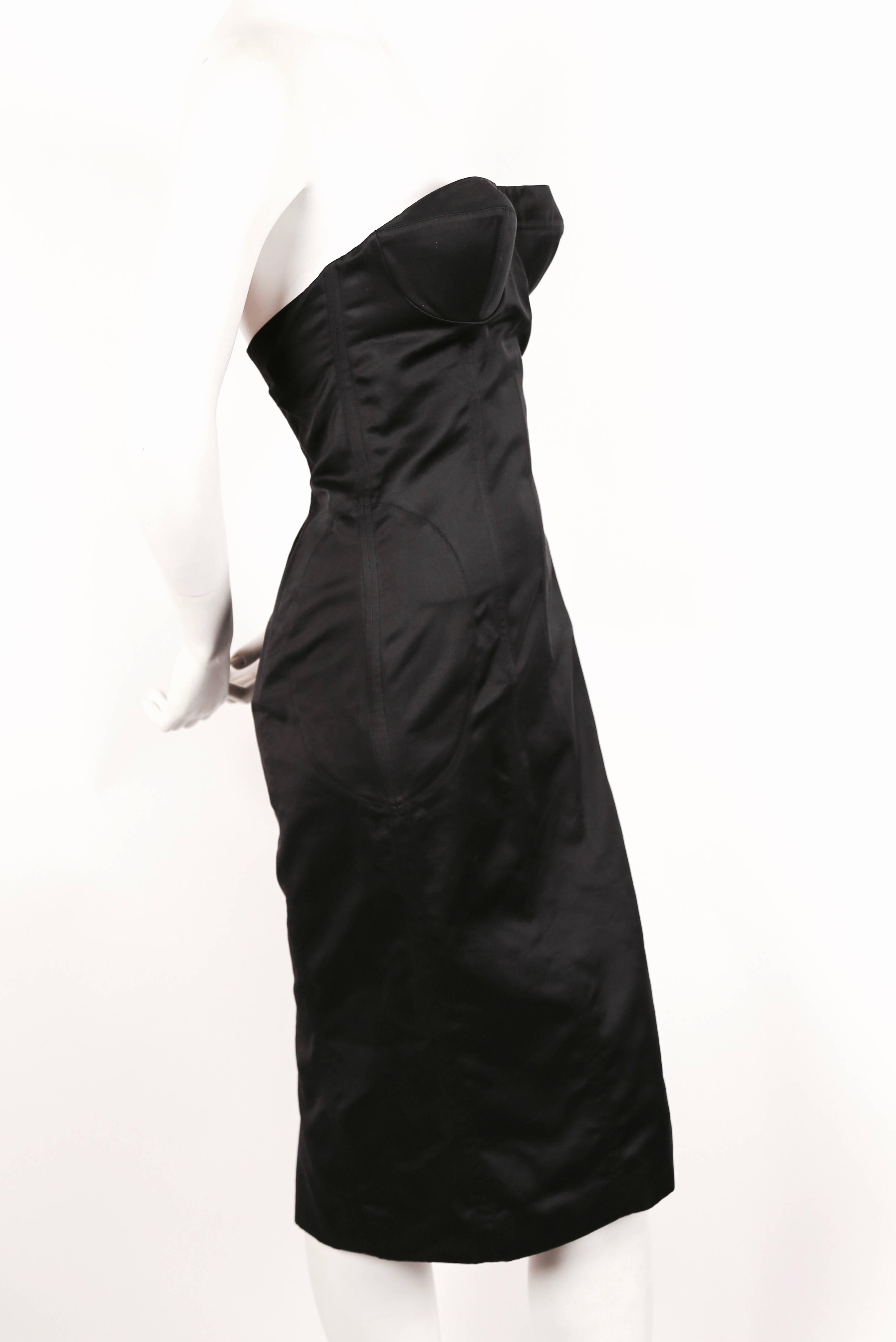 Charcoal grey strapless bustier dress with boning designed by Tom Ford for Gucci dating to spring of 2001. Labeled an Italian size 40. Approximate measurements: bust 34