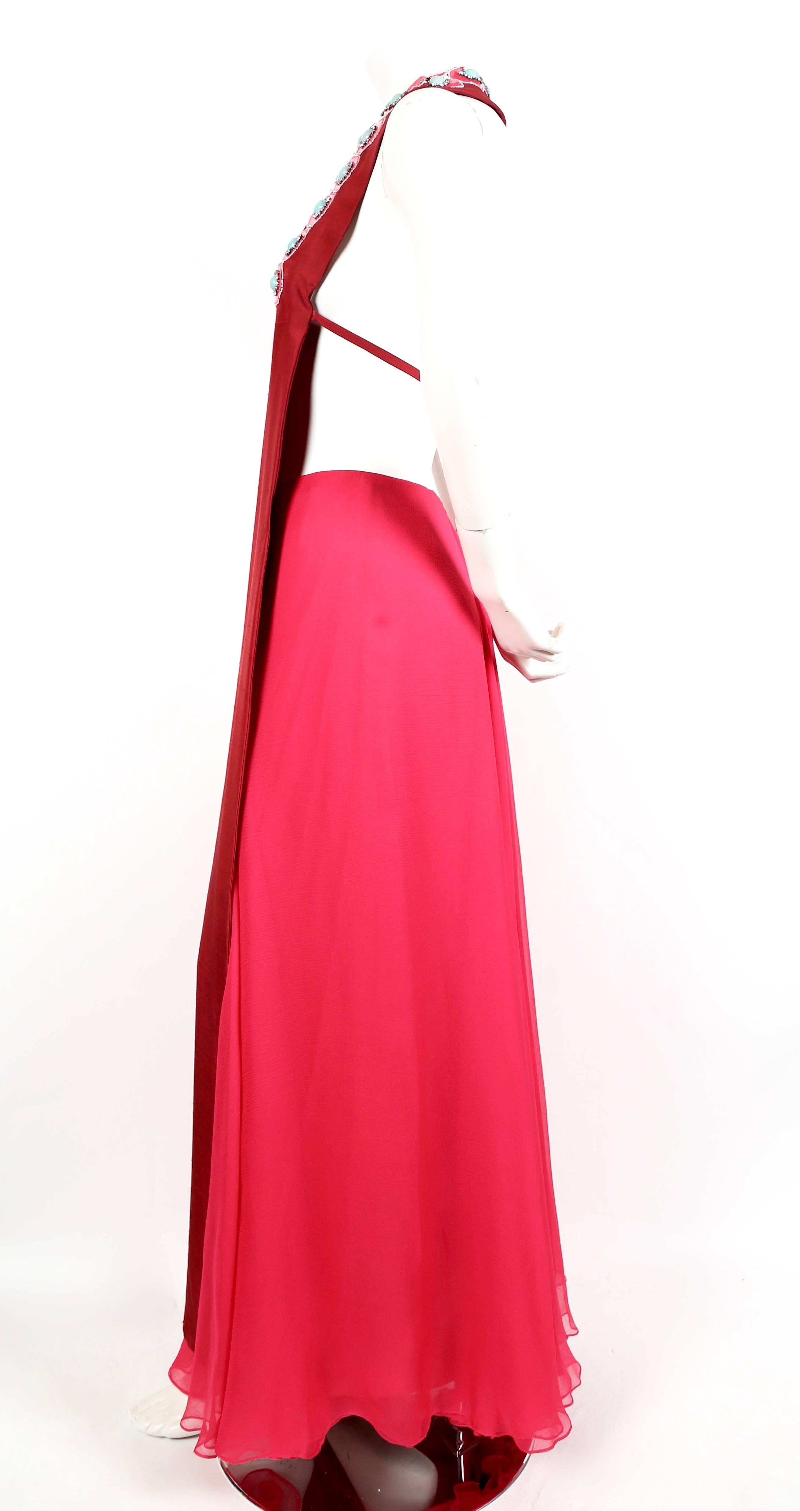 
Very rare slub silk tabard with unusual beading and rhinestones with matching silk chiffon skirt from Madame Gres dating to the late 1960's. Haute couture ensemble with hand finished seams. Skirt can be worn with closure at front or back. Ensemble