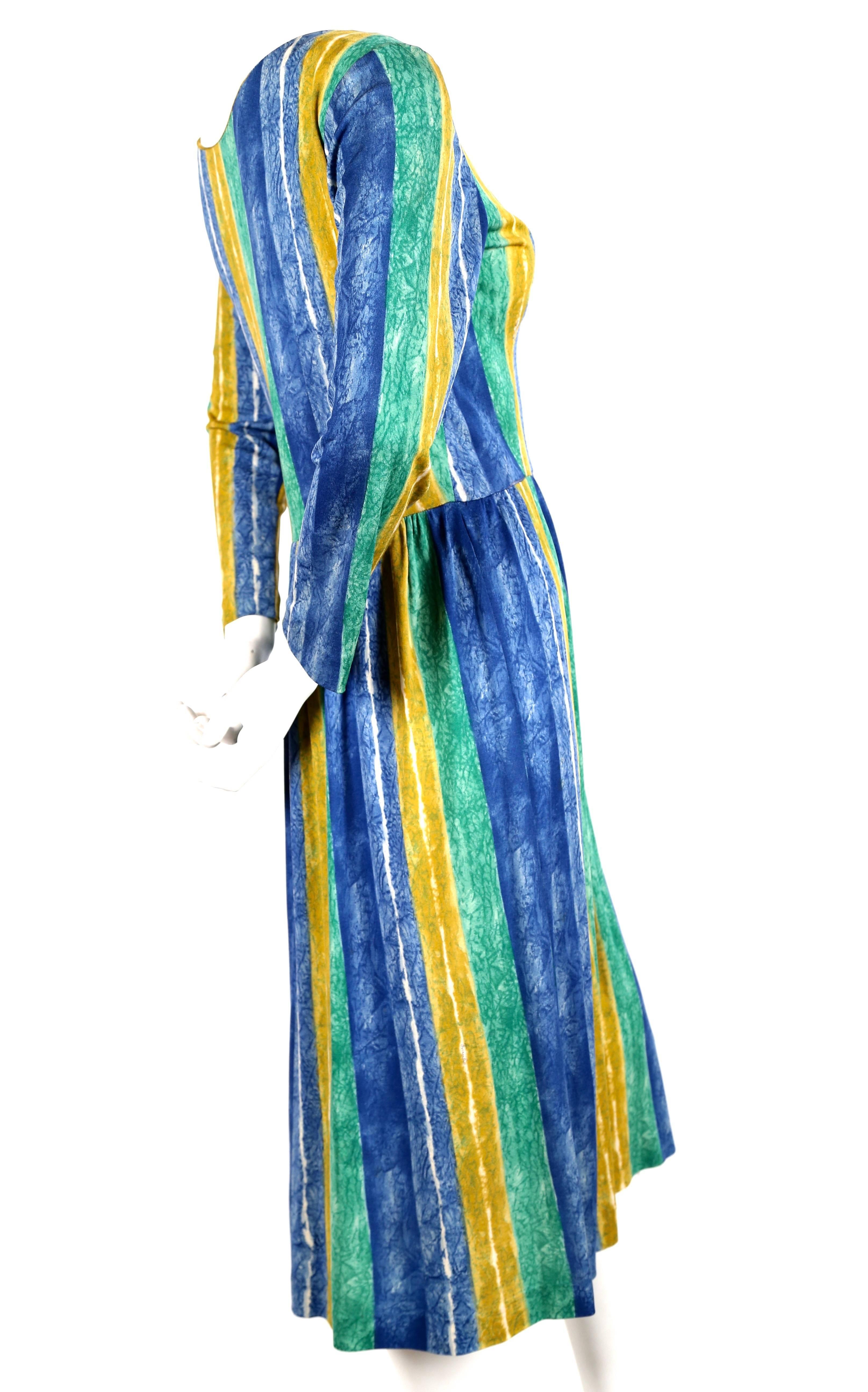 Abstract patterned silk jersey dress from Pucci dating to the 1960's. The colors are very vibrant and include kelly green, azure blue and marigold. Fabric is signed 'PUCCI' in numerous places. Best fits a US 8 or 10. Bust measures approximately 38