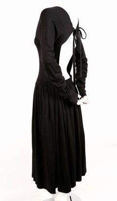 1985 COMME DES GARCONS black runway dress with open back and exaggerated arms
