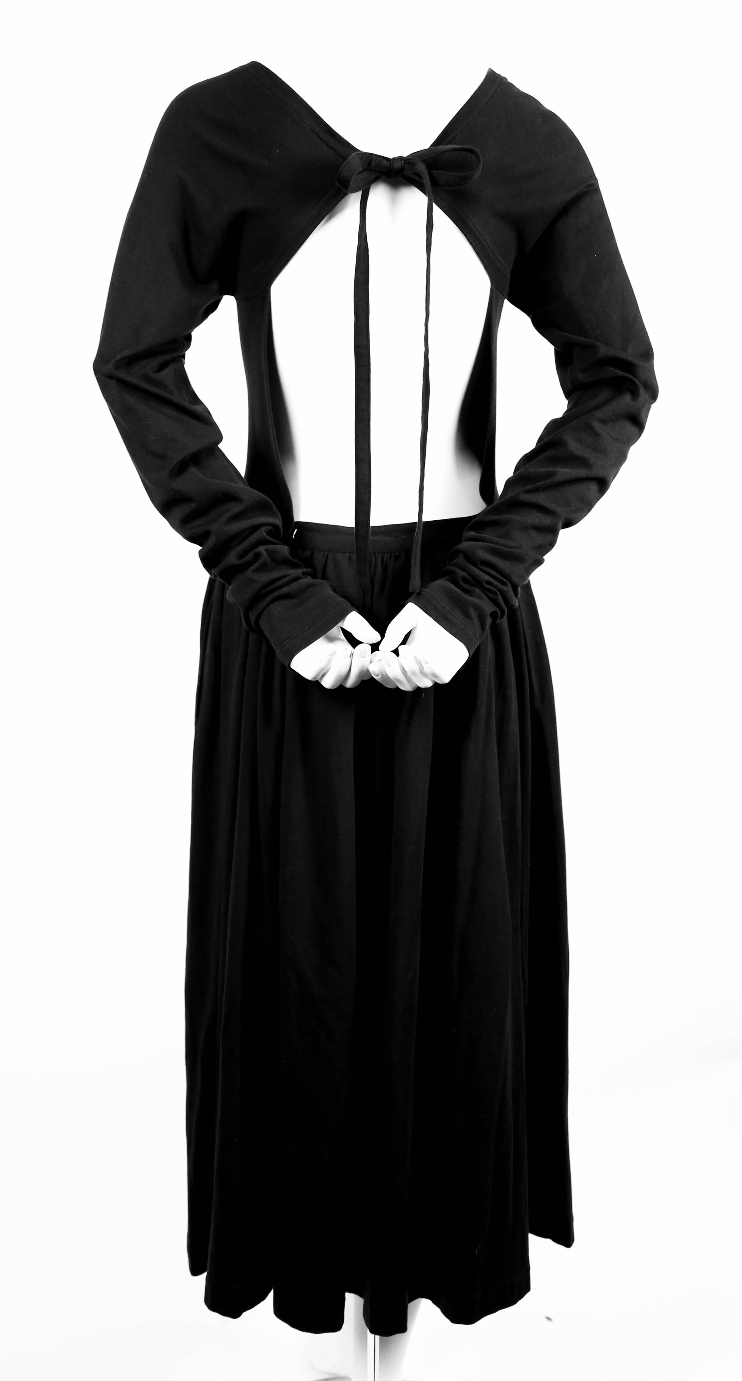 Black 1985 COMME DES GARCONS black runway dress with open back and exaggerated arms