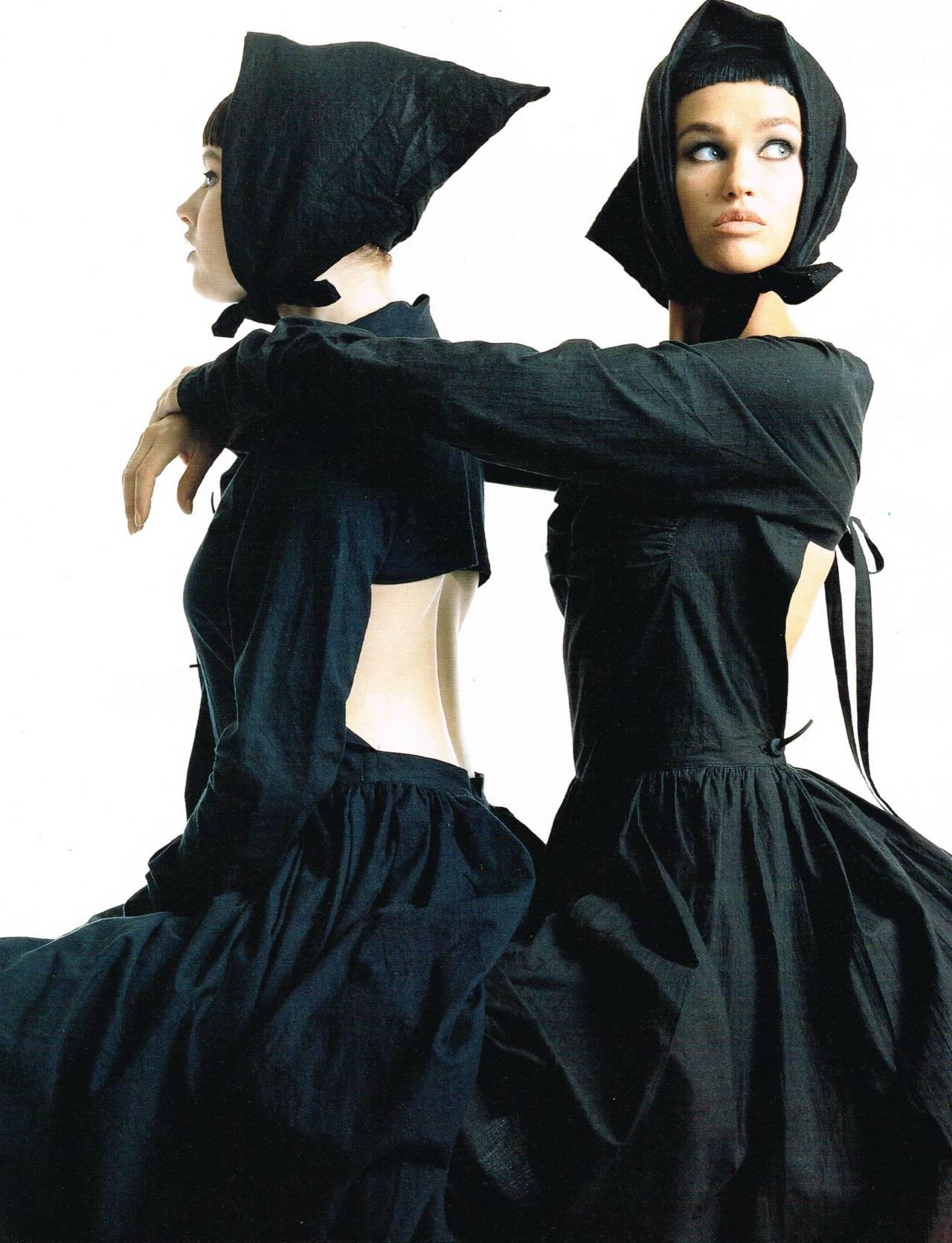 1985 COMME DES GARCONS black runway dress with open back and exaggerated arms 1