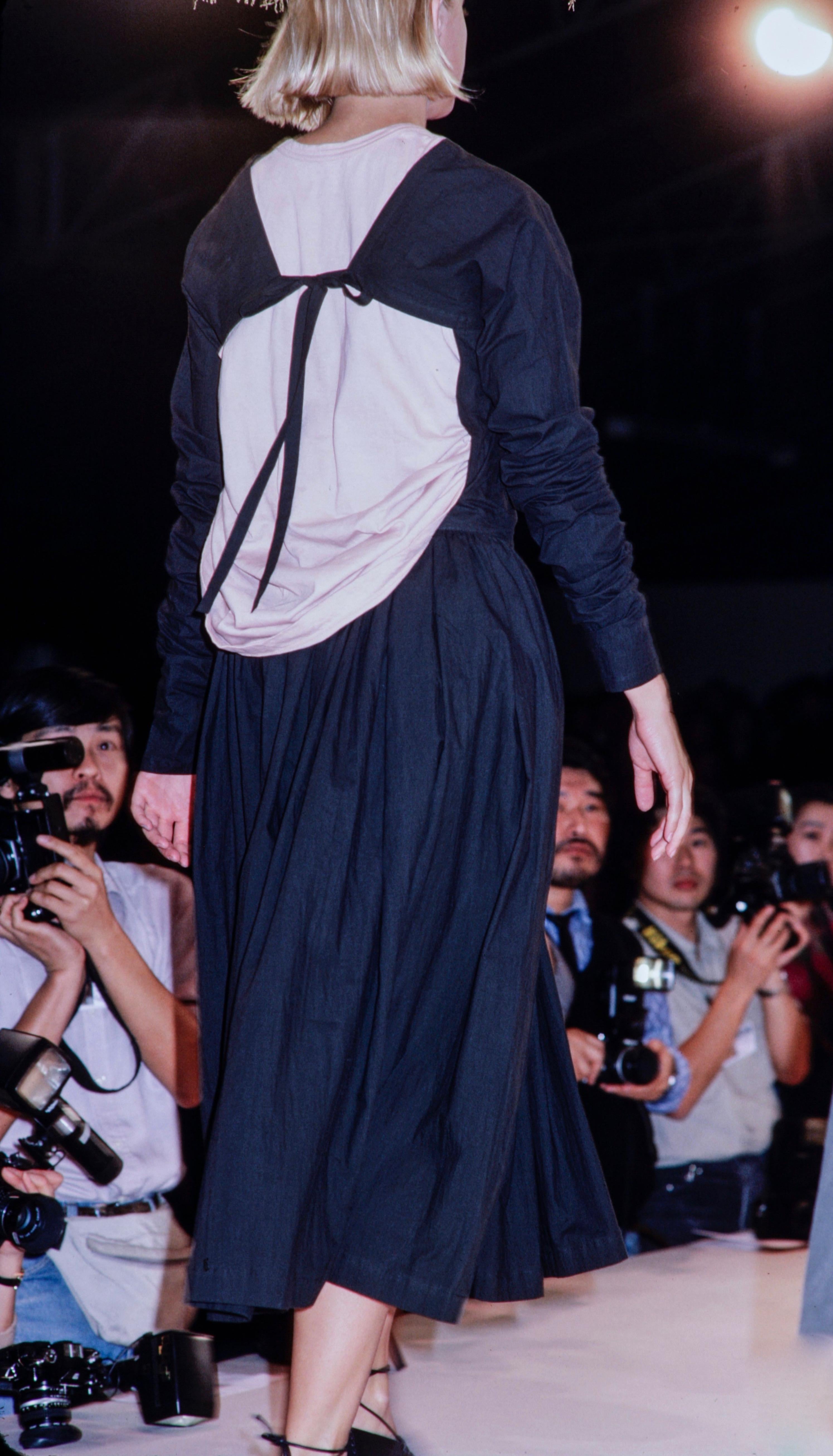 1985 COMME DES GARCONS black runway dress with open back and exaggerated arms 2